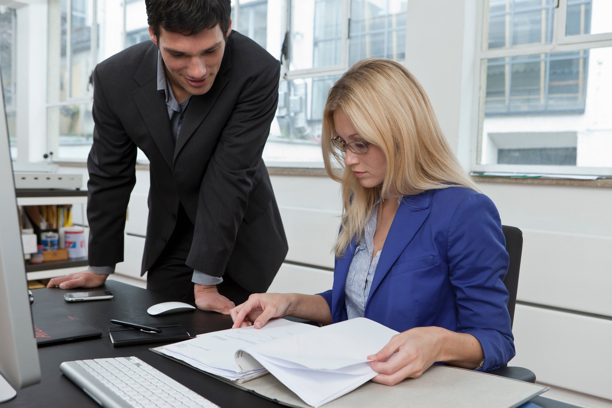 Colleagues reviewing a business plan