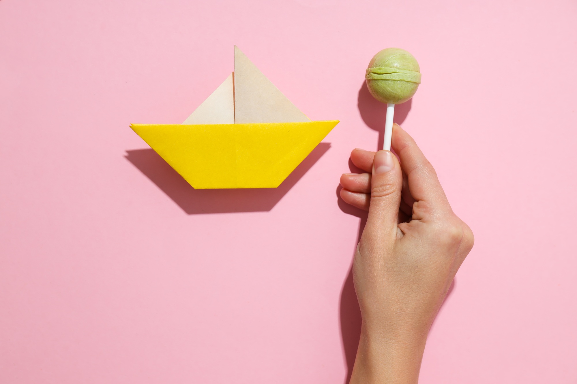 Concept of movement towards the goal with paper boat