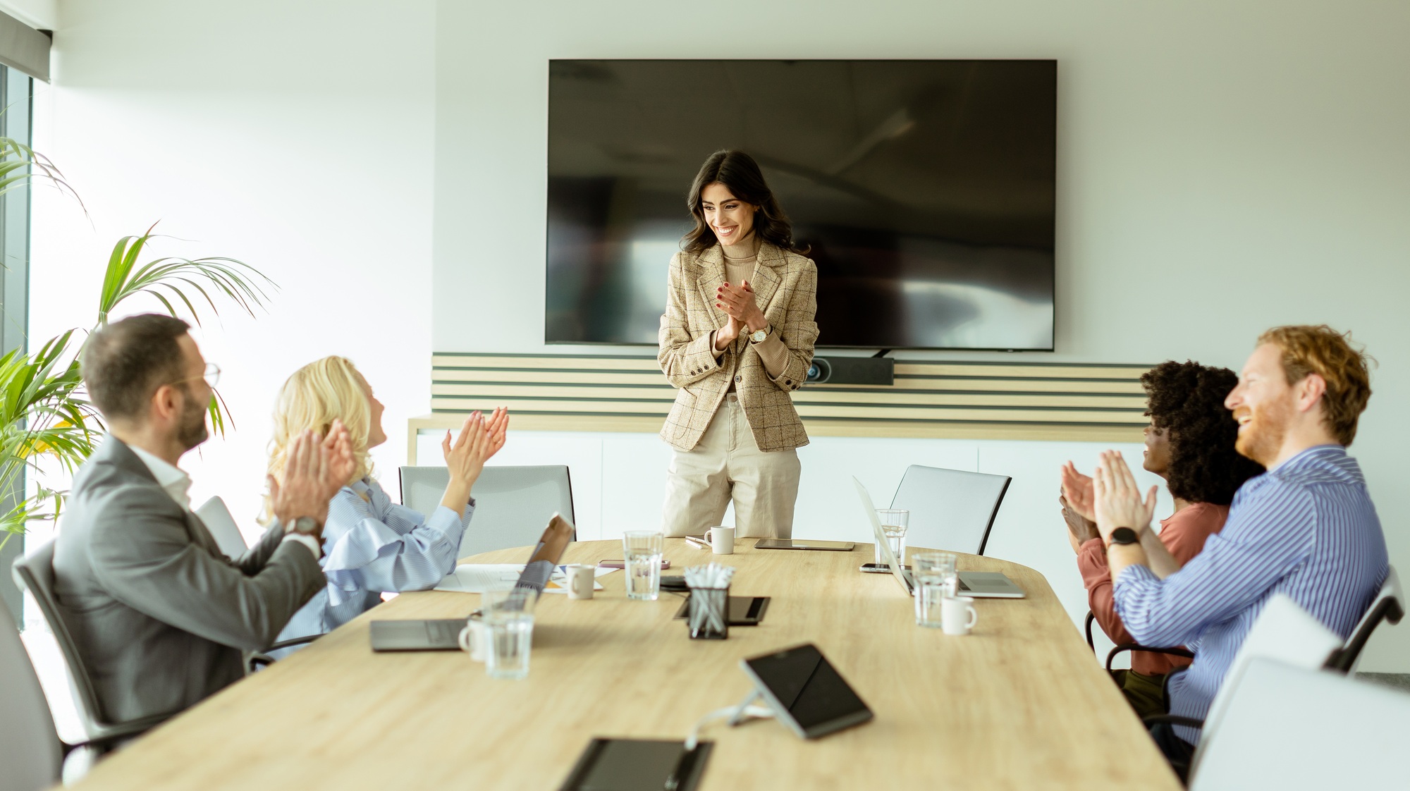 Confident businesswoman leading a strategic planning session in a modern office
