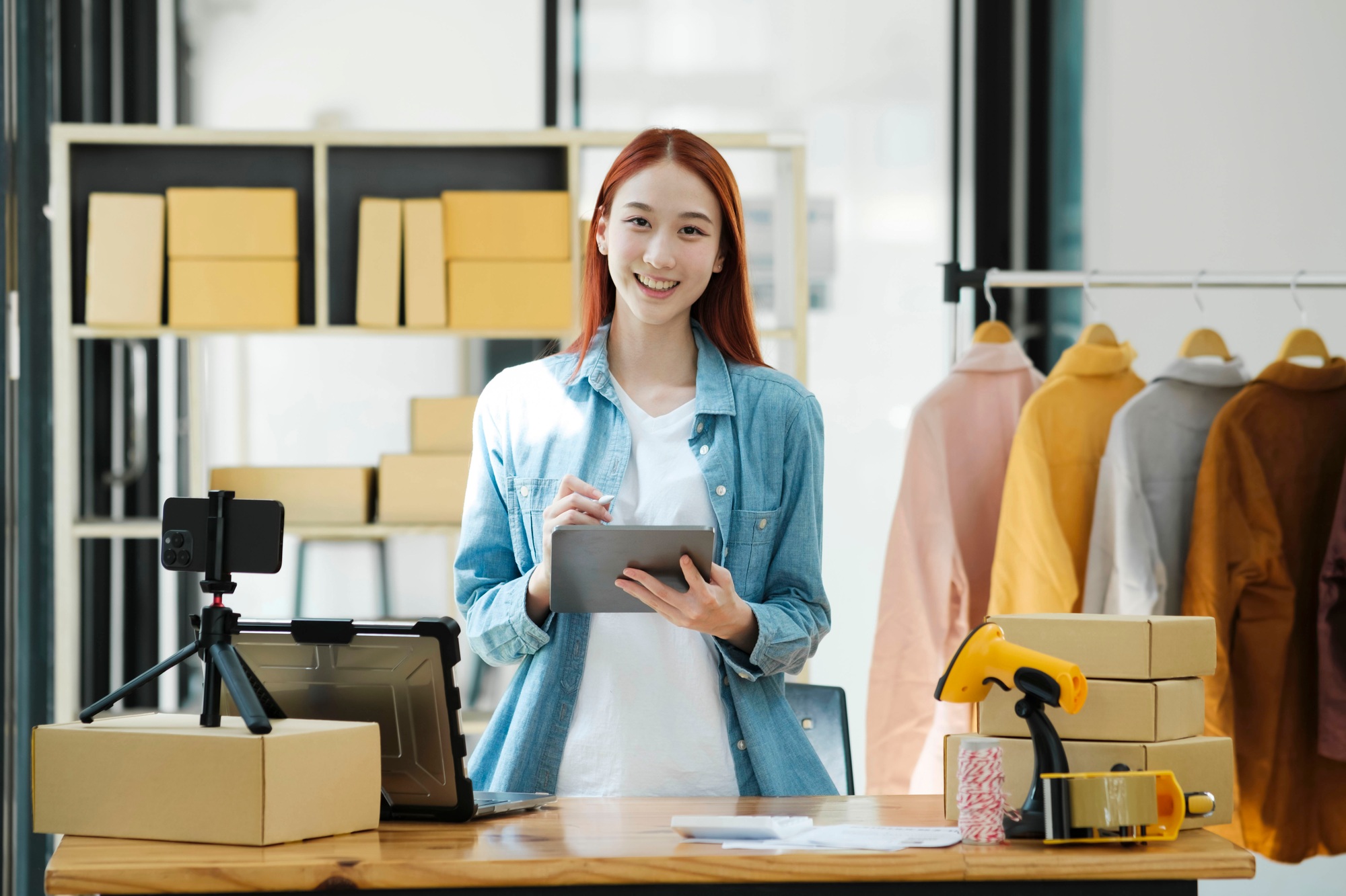 Confident woman portrait entrepreneur at ecommerce fashion or warehouse looking at camera.