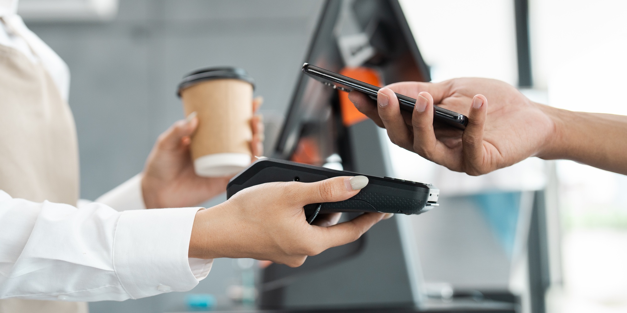 Contactless Payment Transaction at Coffee Shop with Smartphone and POS Terminal