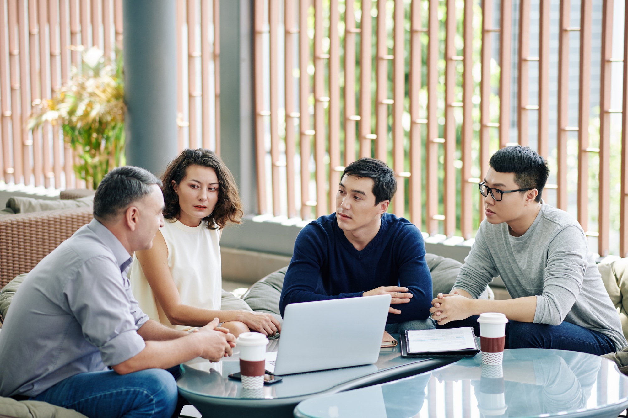 Coworkers discussing plan of project development