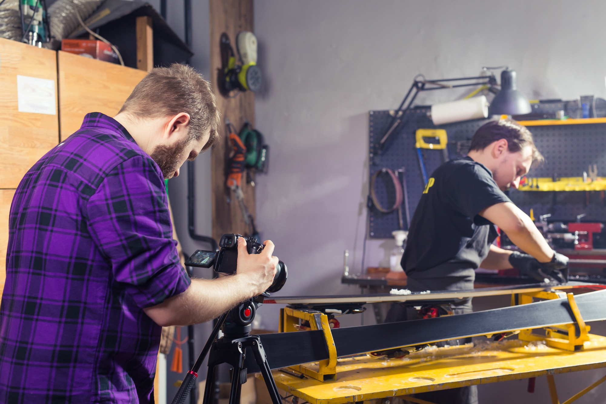 Creation of advertising content for social networks. Photographer on a shooting day in a repair