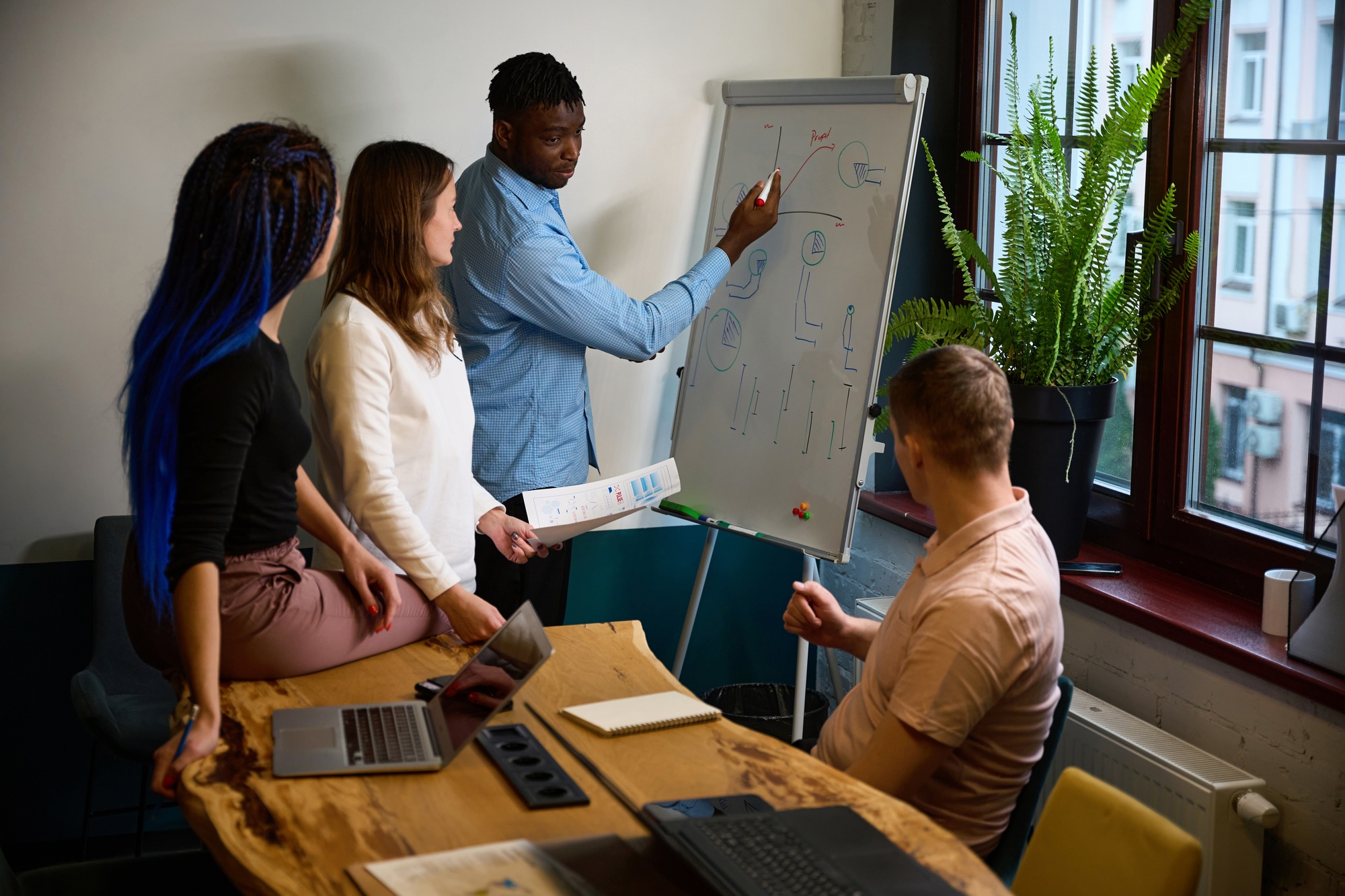 Creative team of building development company discussing ideas and strategies