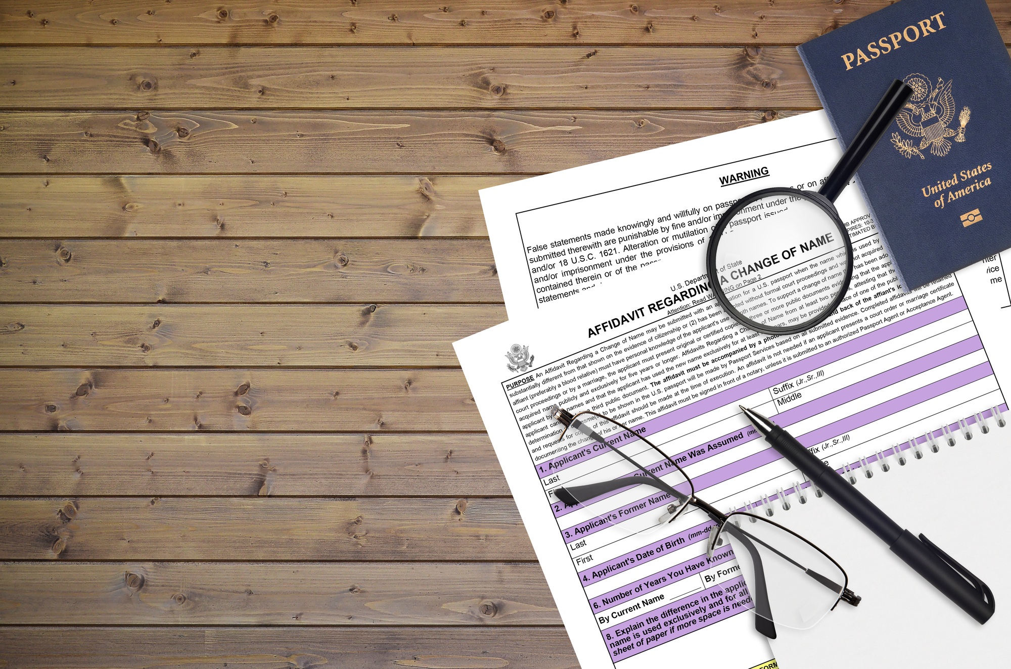 Department of State form DS60 Affidavit Regarding a change of name lies on table and ready to fill