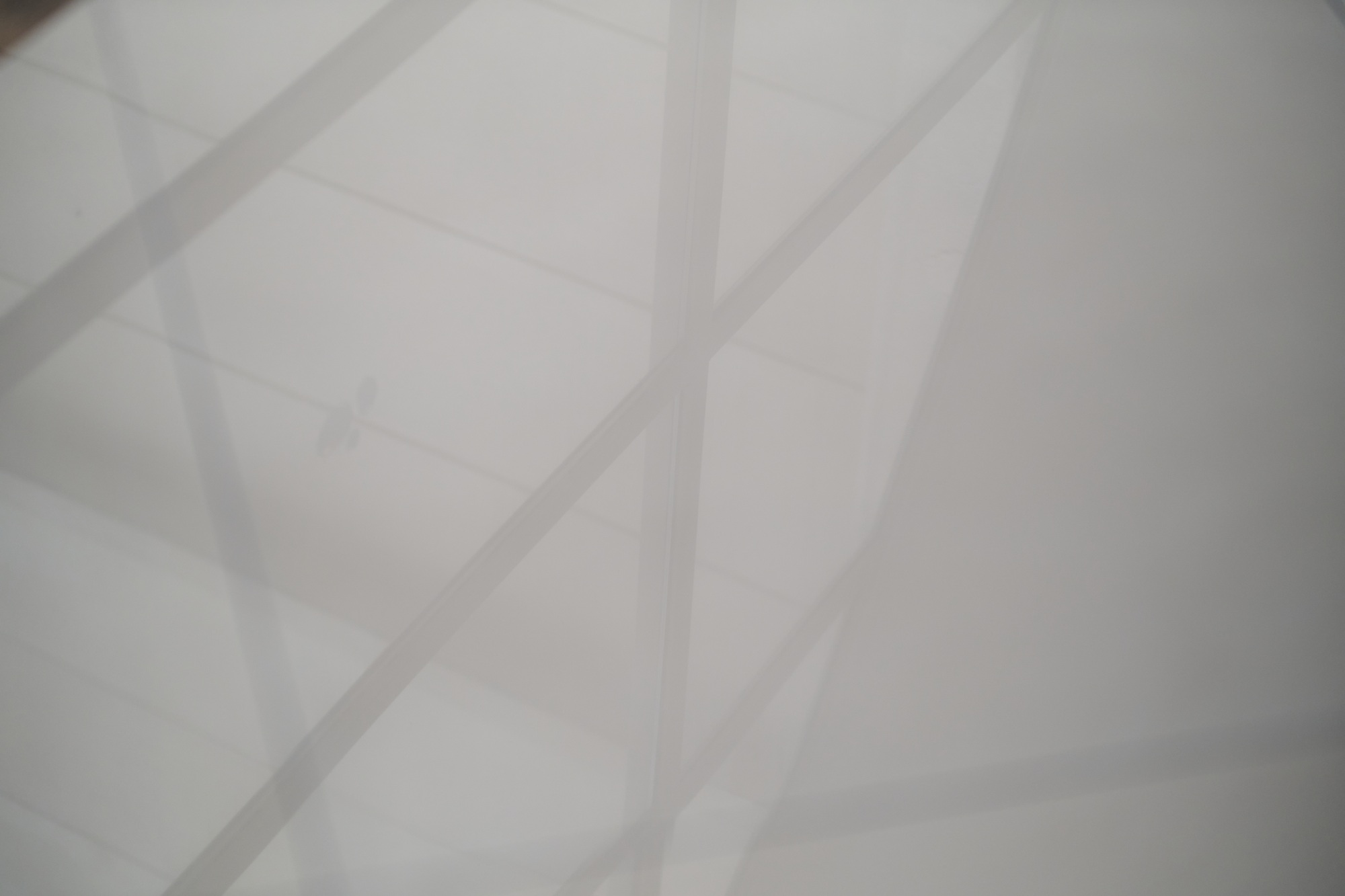 Designers' backdrop: shadow play on a luminous floor. Geometric silhouettes dance