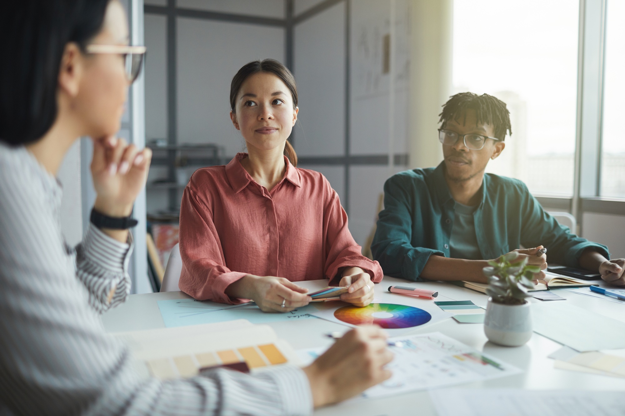 Designers with customer discussing work