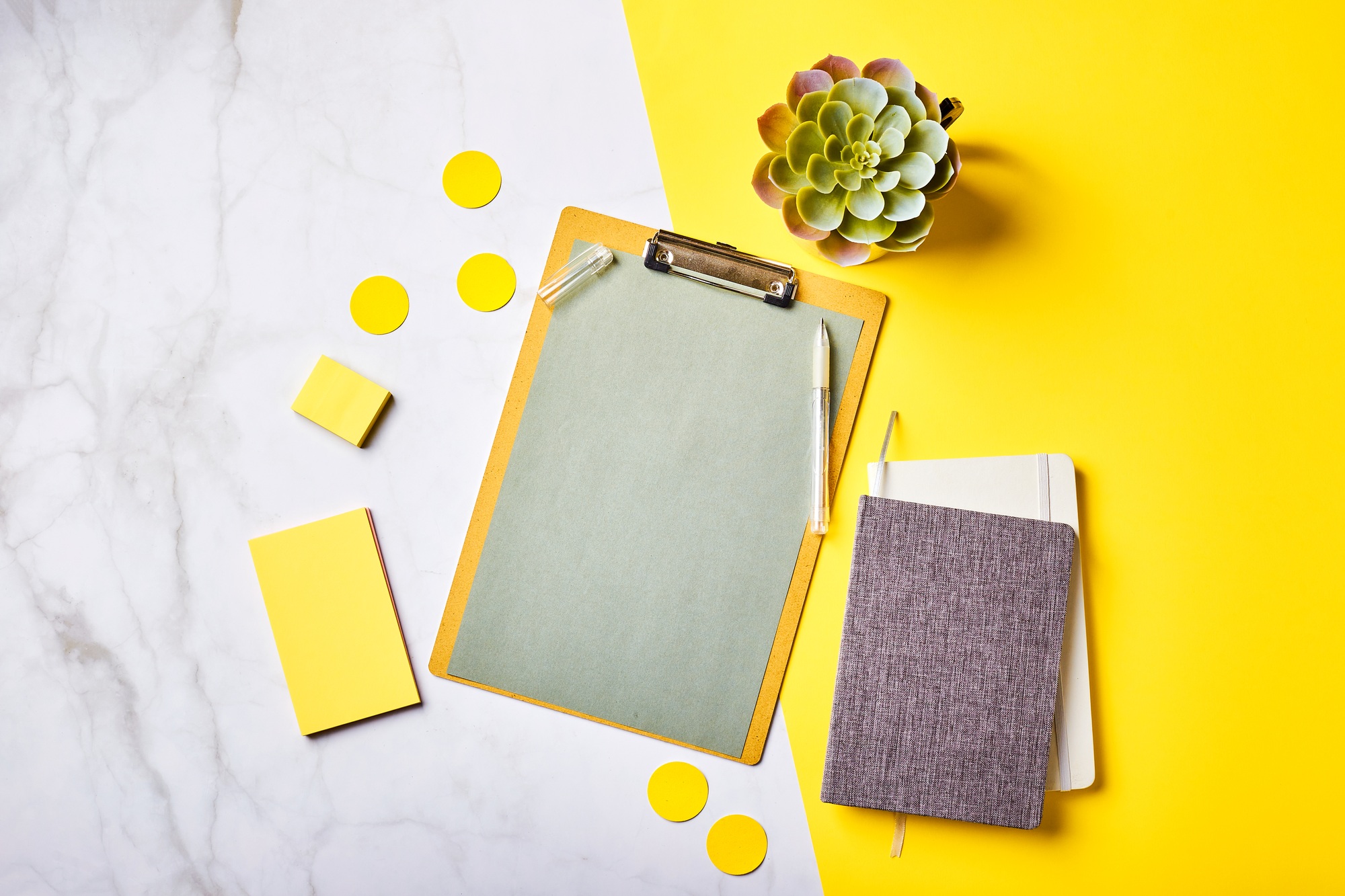 Desktop with clipboard mockup and office supplies. Home office, planning goal setting concept