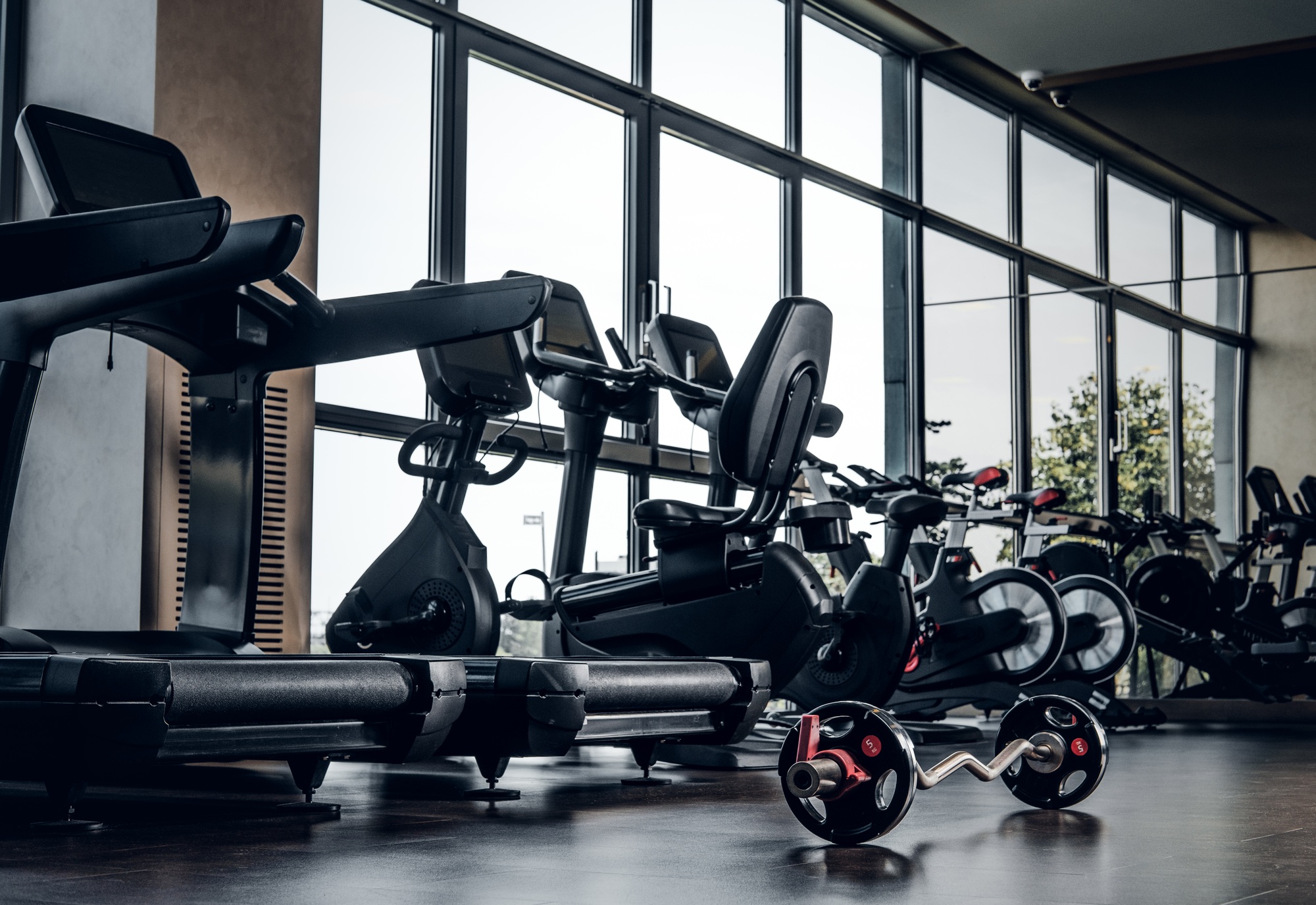 Empty gym club with different type of training apparatuses