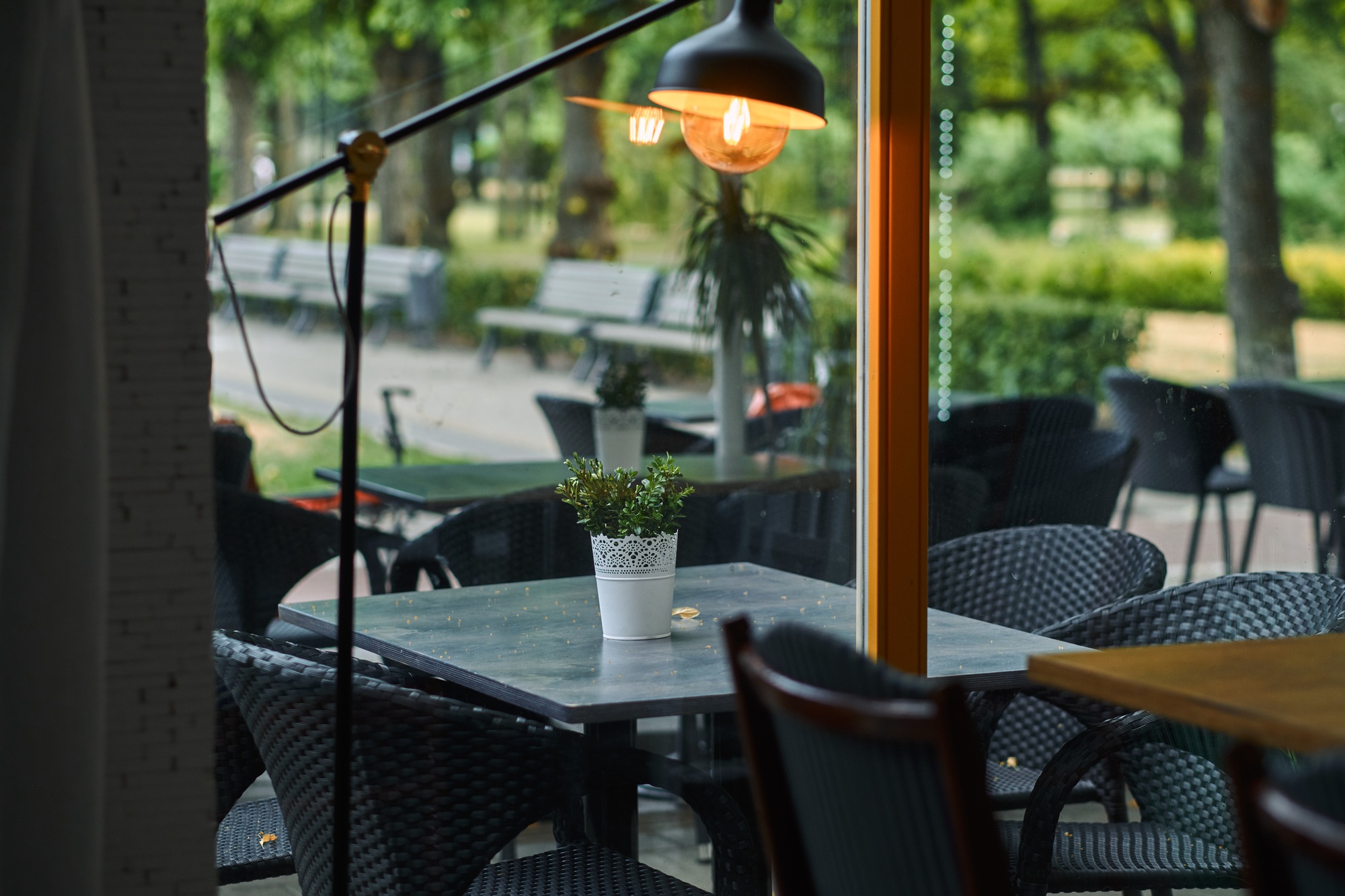 Empty outdoor cafe. Tables and chairs at restaurant terrace.