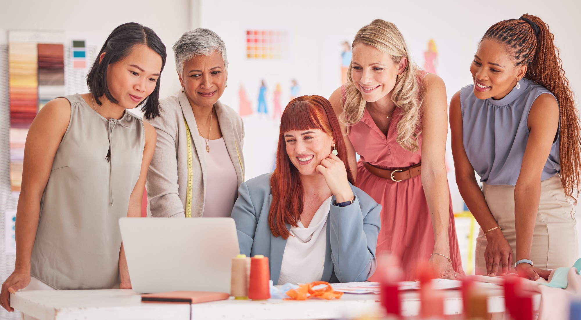 Fashion, retail and design team on laptop for ecommerce, sale and profit review in office. Partners