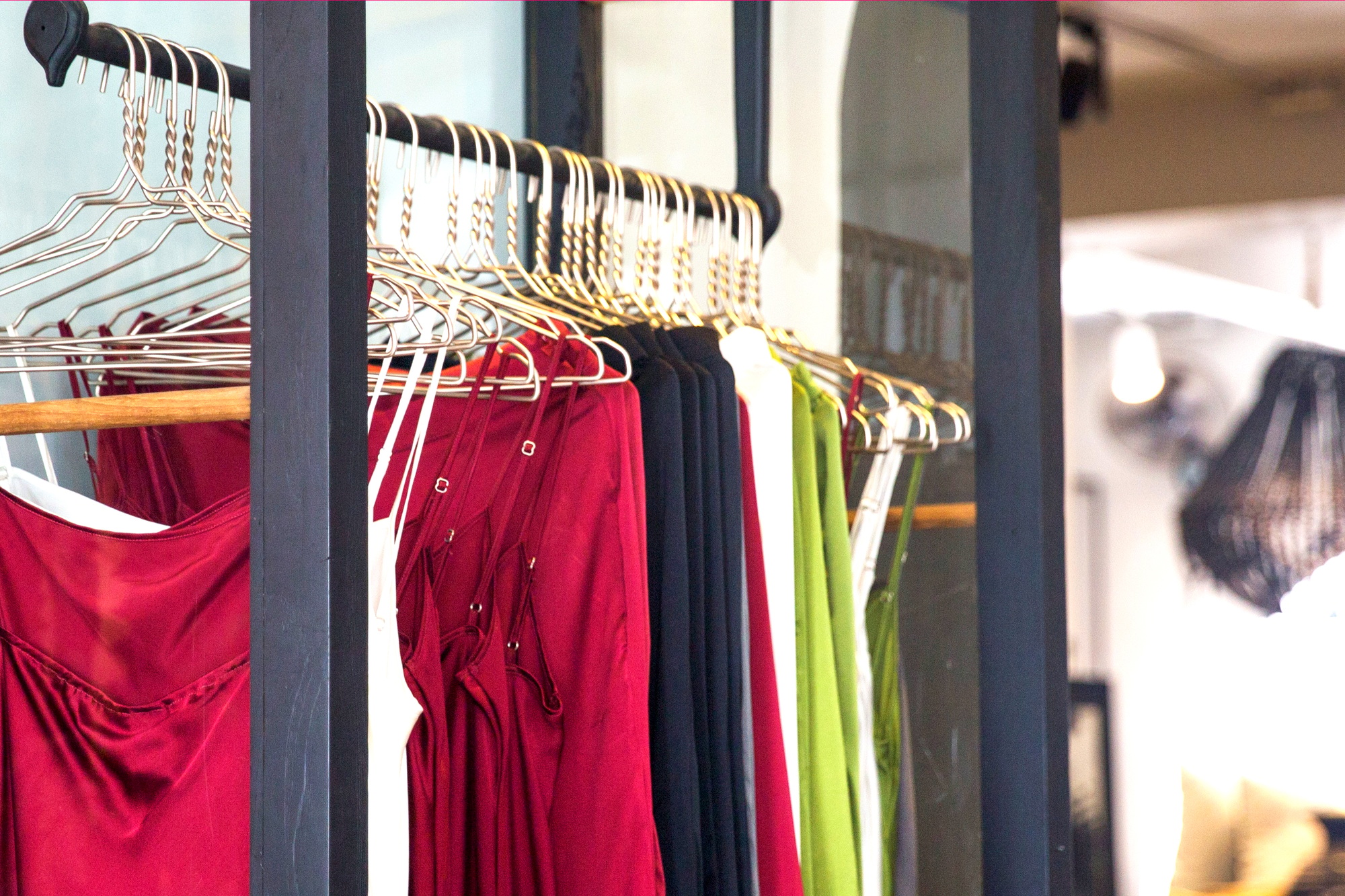 Fashionable clothes is hanging in the store