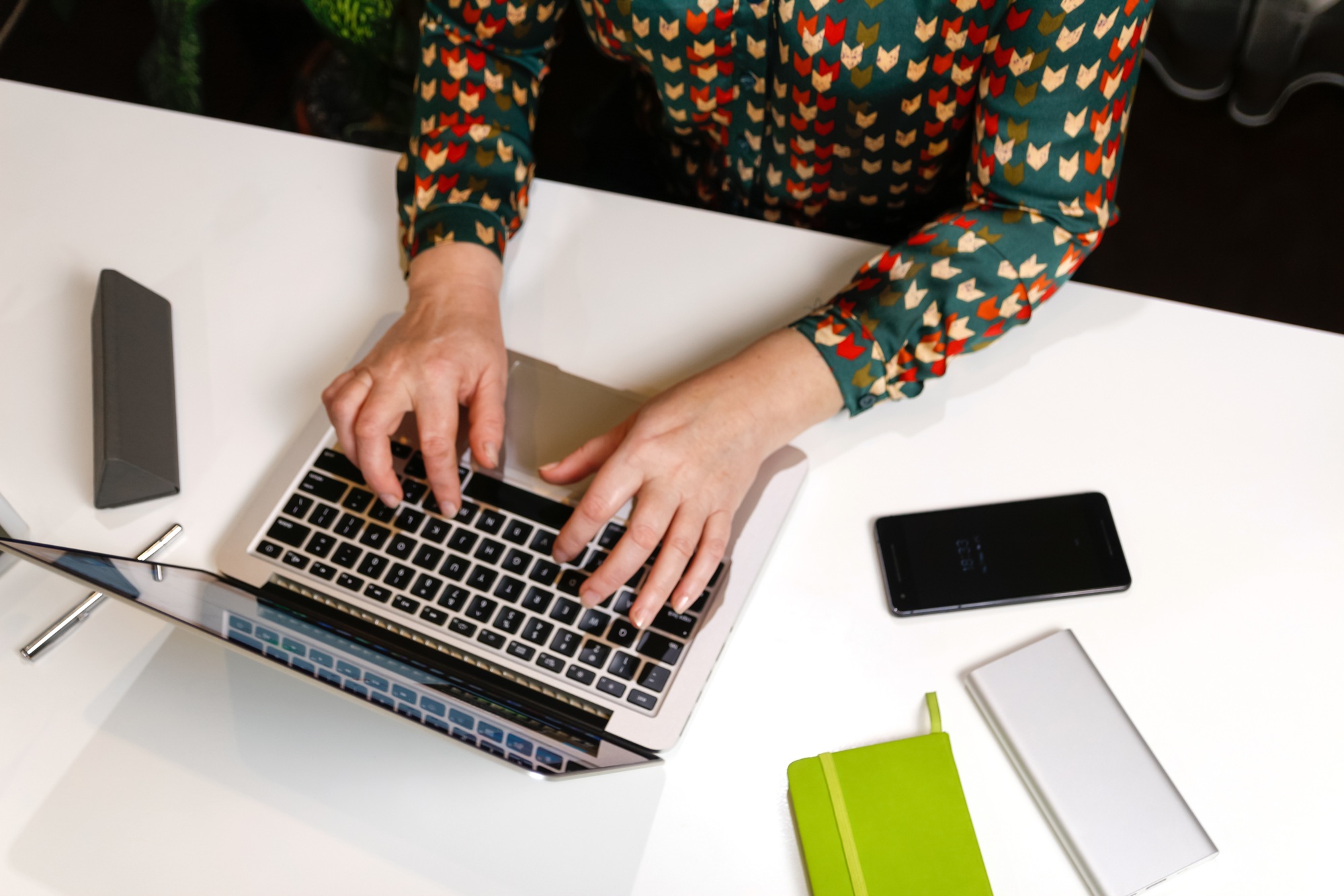 Female hand typing keyboard on laptop. Unrecognizable elegant woman working on computer at office. S