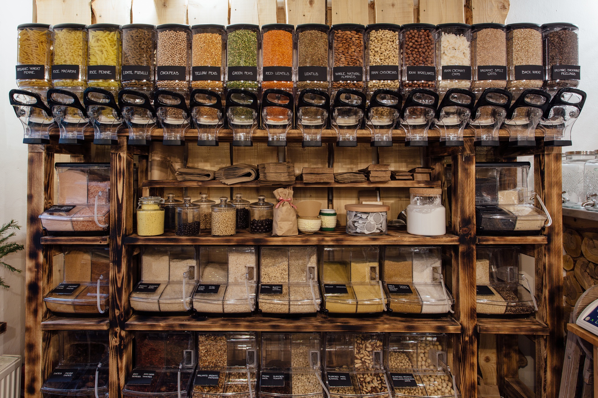 Front view of variety of seeds and nuts displayed in grocery store.