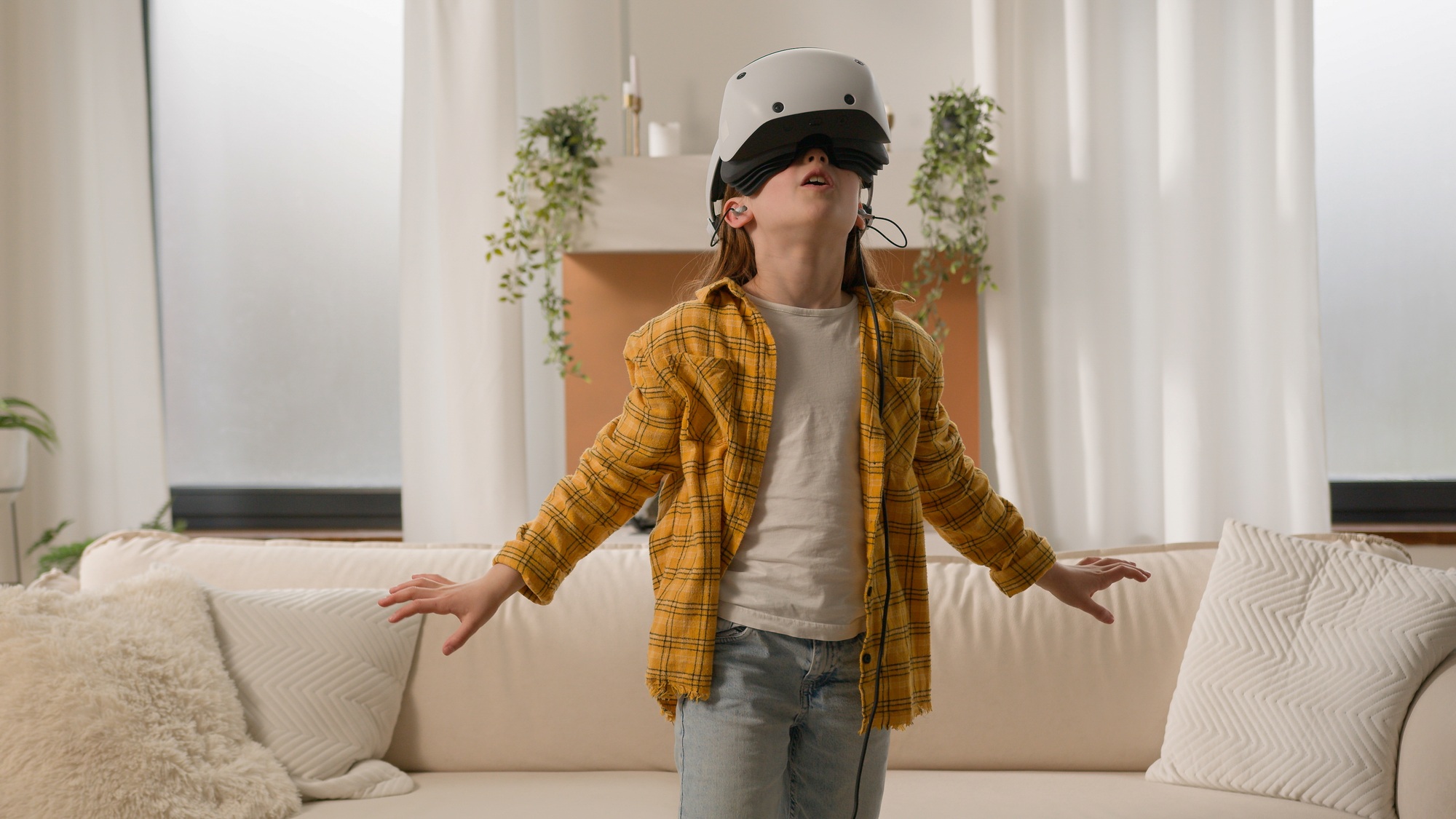 Funny happy kid girl playing online video 3d game using virtual reality headset child schoolgirl