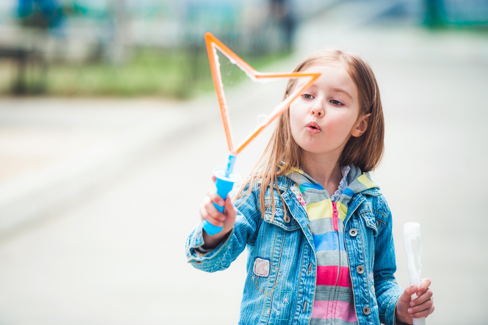 Girl making soap bubbles