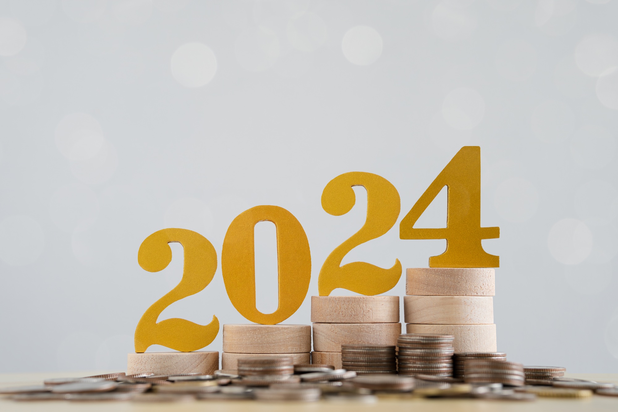 Goal concept. Year 2024 with celebration. 2024 wooden blocks on gray background.
