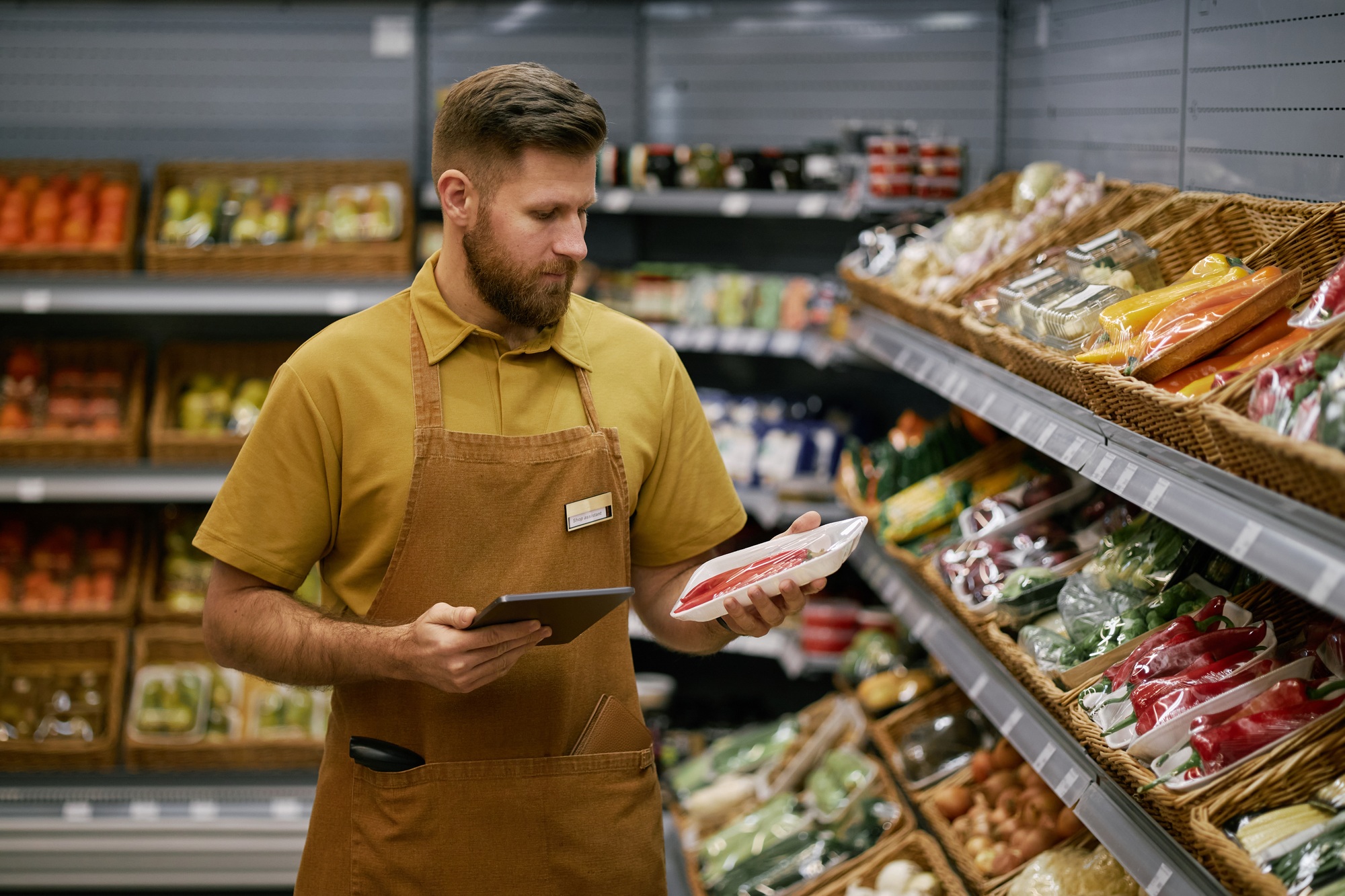 Grocery Store Worker Checking Product Inventory