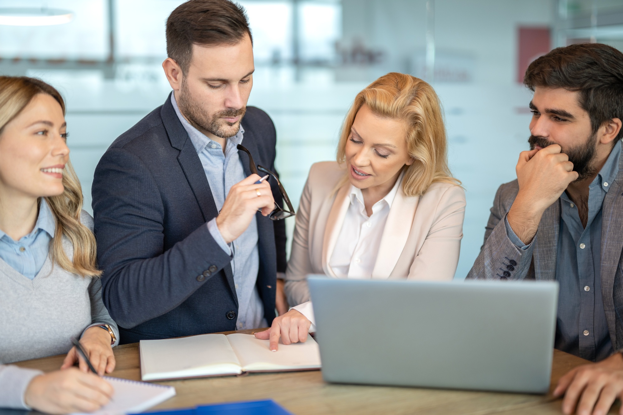 Group of business partners planning work schedule at meeting