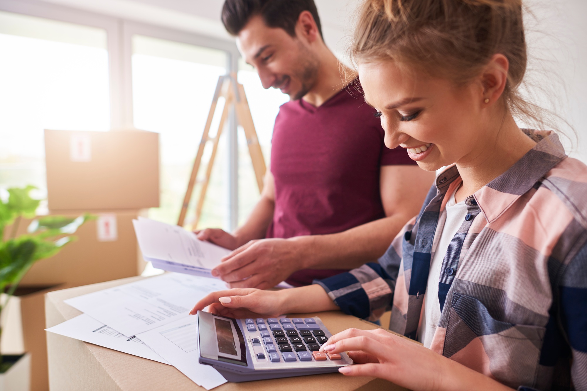 Happy couple planning their budget