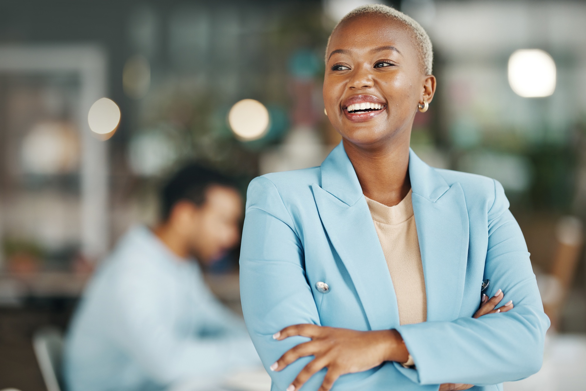 Happy, smile and arms crossed with black woman in office for leadership, management and development