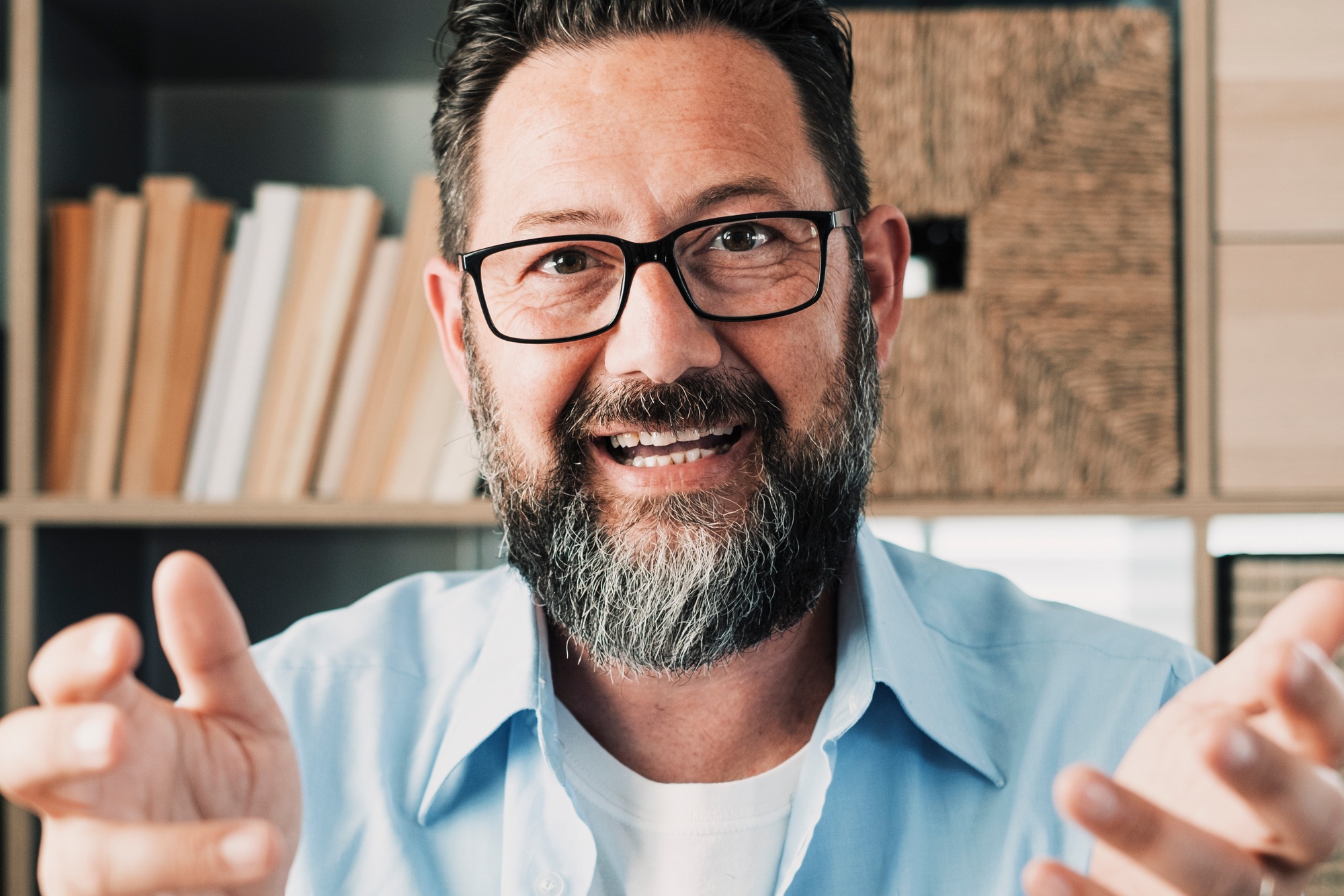 Head shot portrait confident businessman coach wearing glasses looking at camera and talking