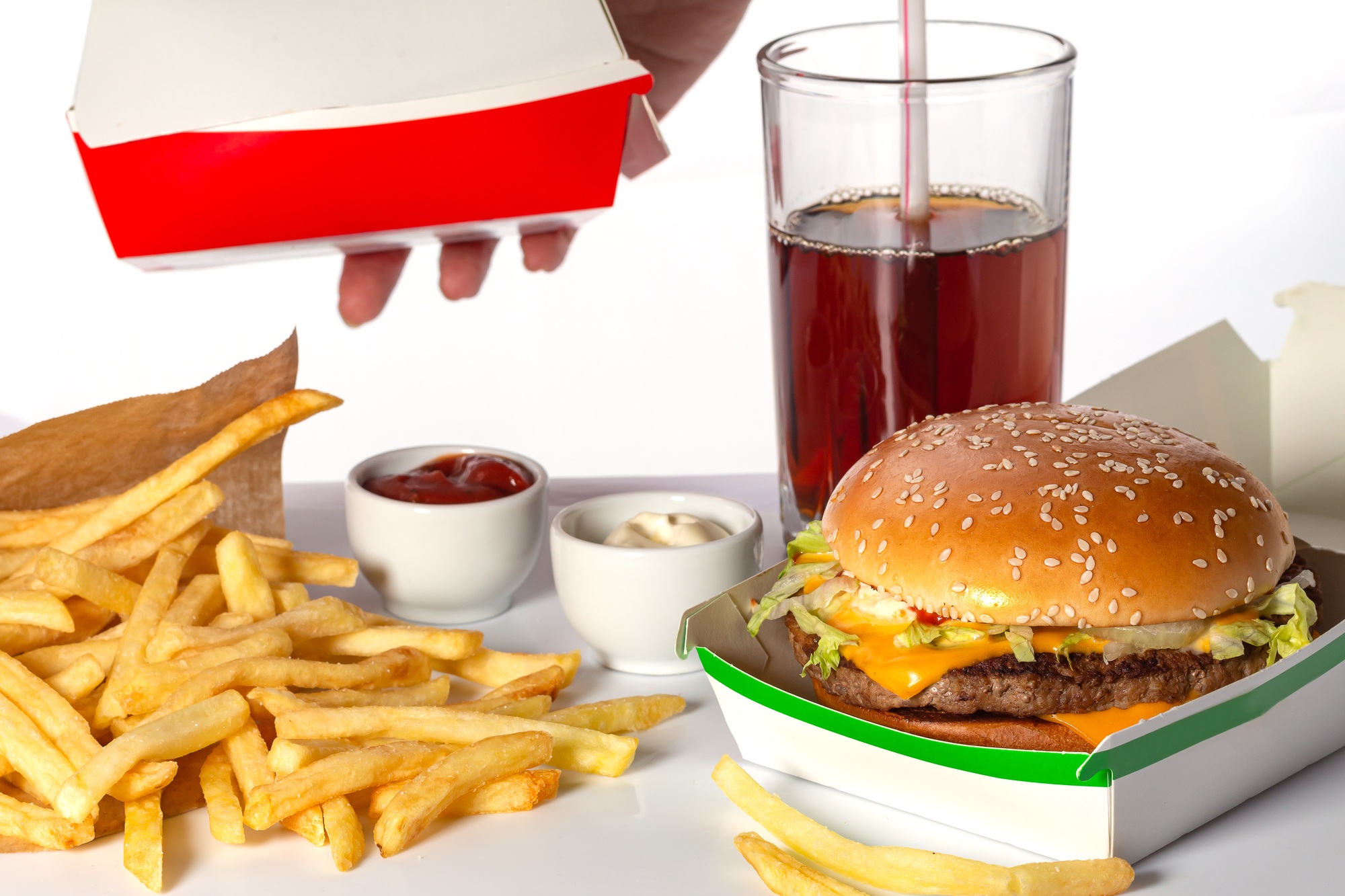 home delivery, fast food. Burgers, french fries in package on white background.