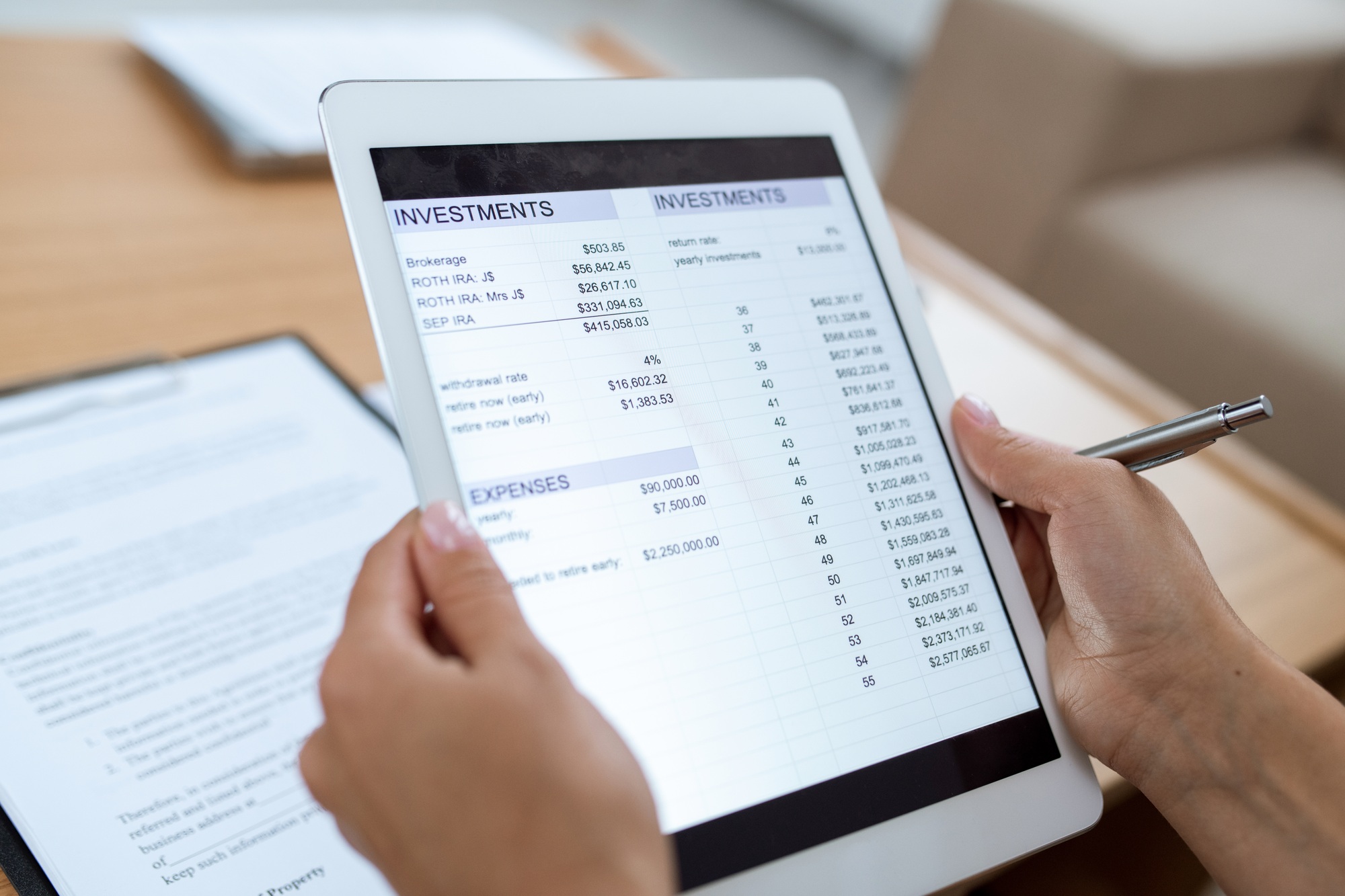 Human hands holding touchpad with electronic financial document