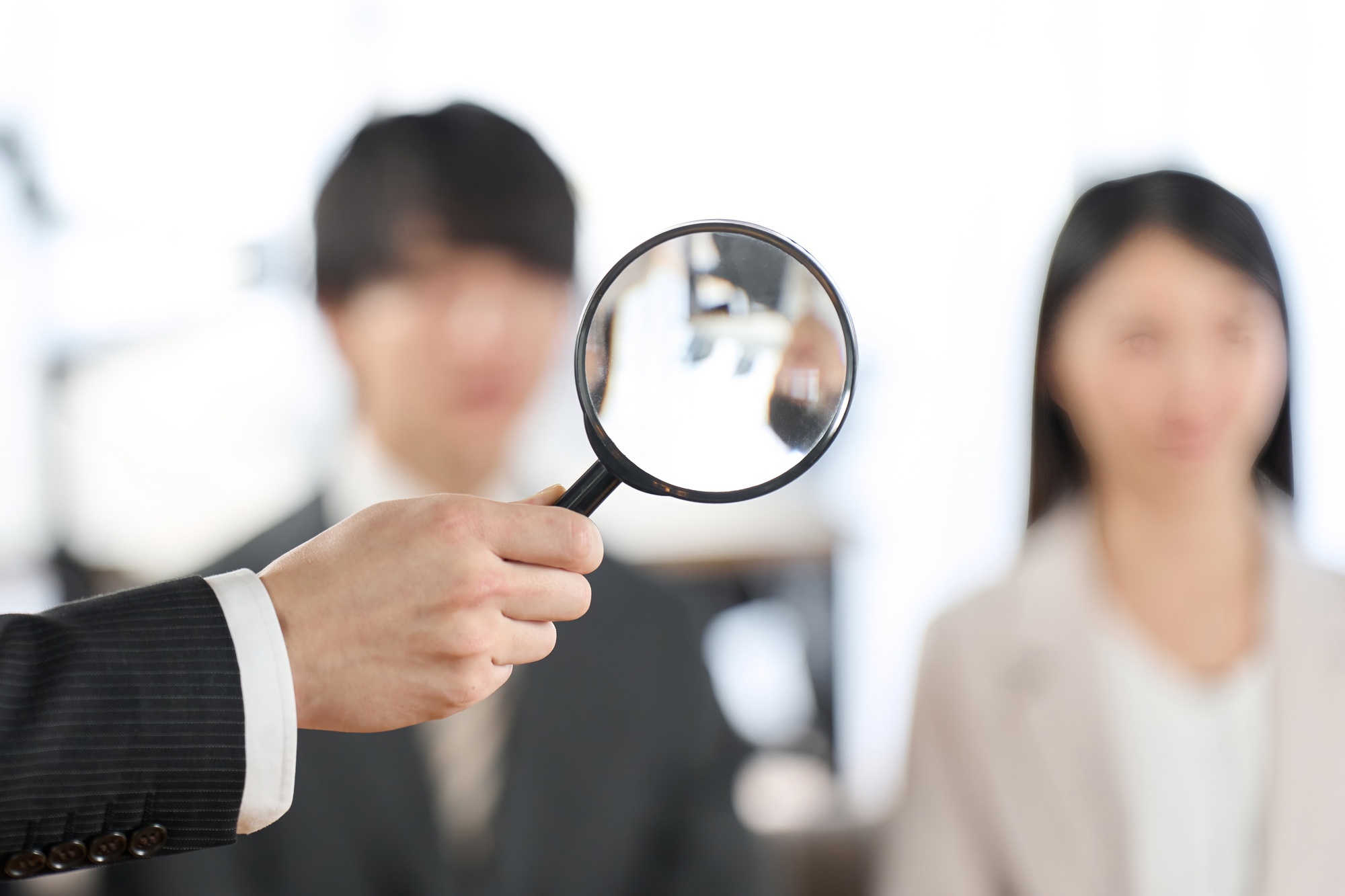 Image of searching for human resources with a magnifying glass