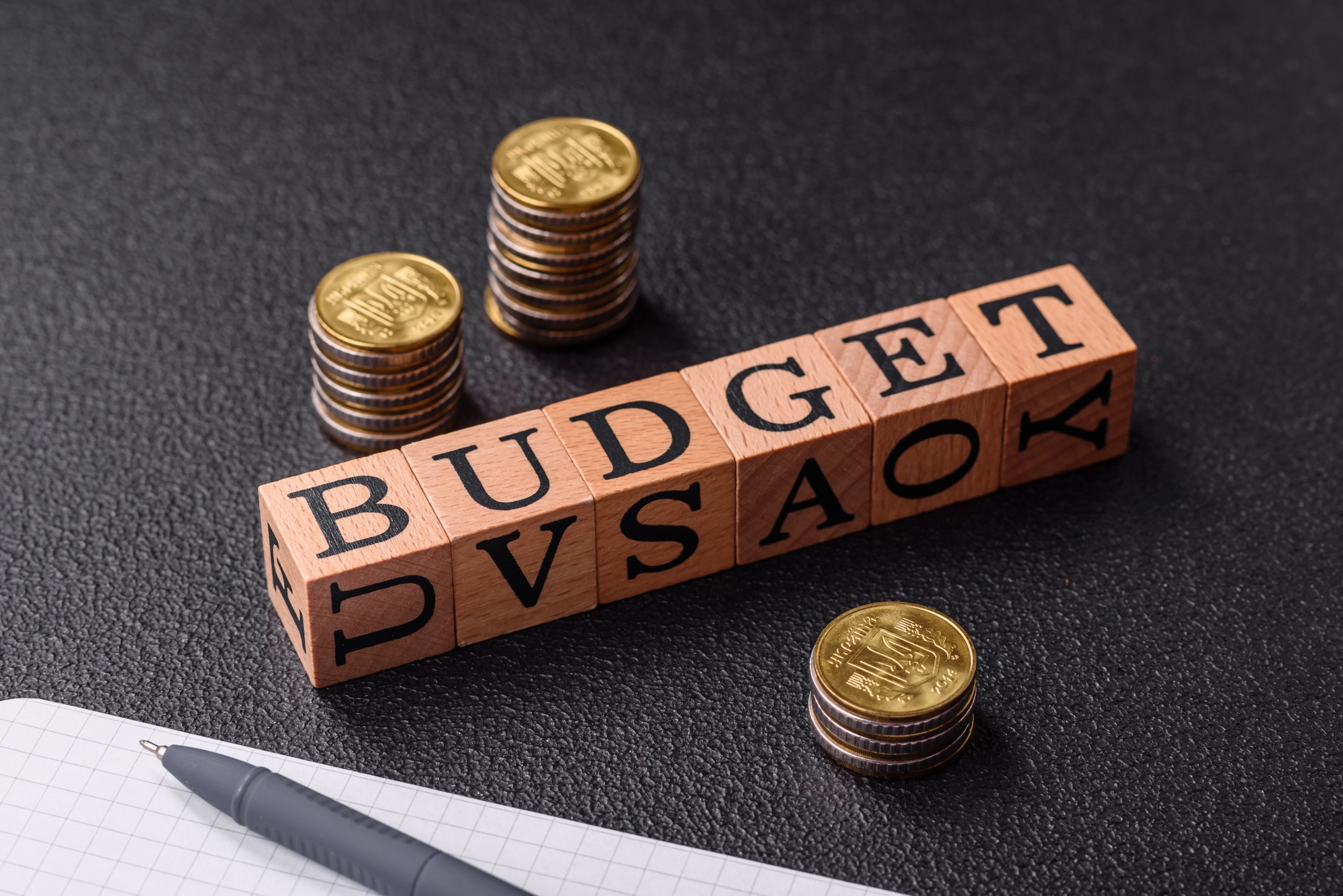Inscription Budget wooden cubes, concept background with copy space