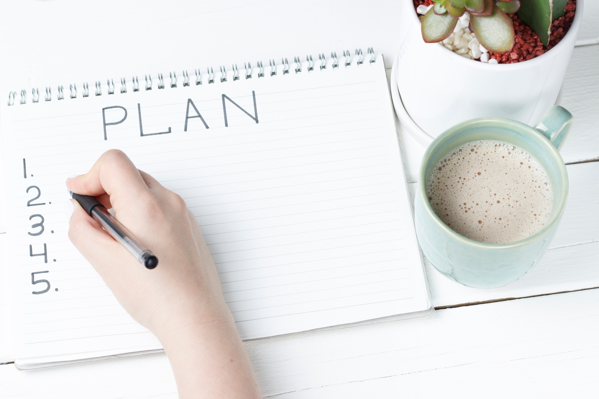 Inscription Plan in notepad, close-up, top view, concept of planning, goal setting