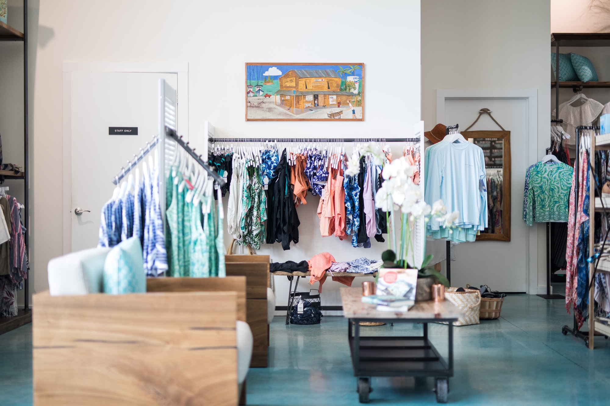 Interior of clothing store shop vintage clothes, hats and homewares clocks