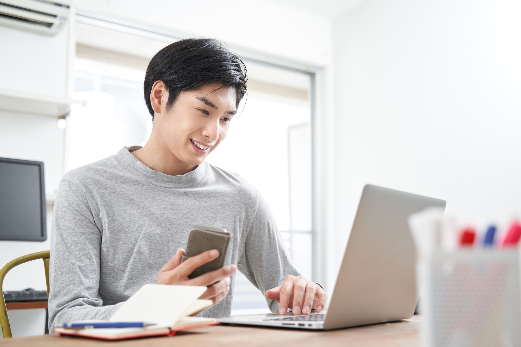 Japanese male businessman working from home in plain clothes