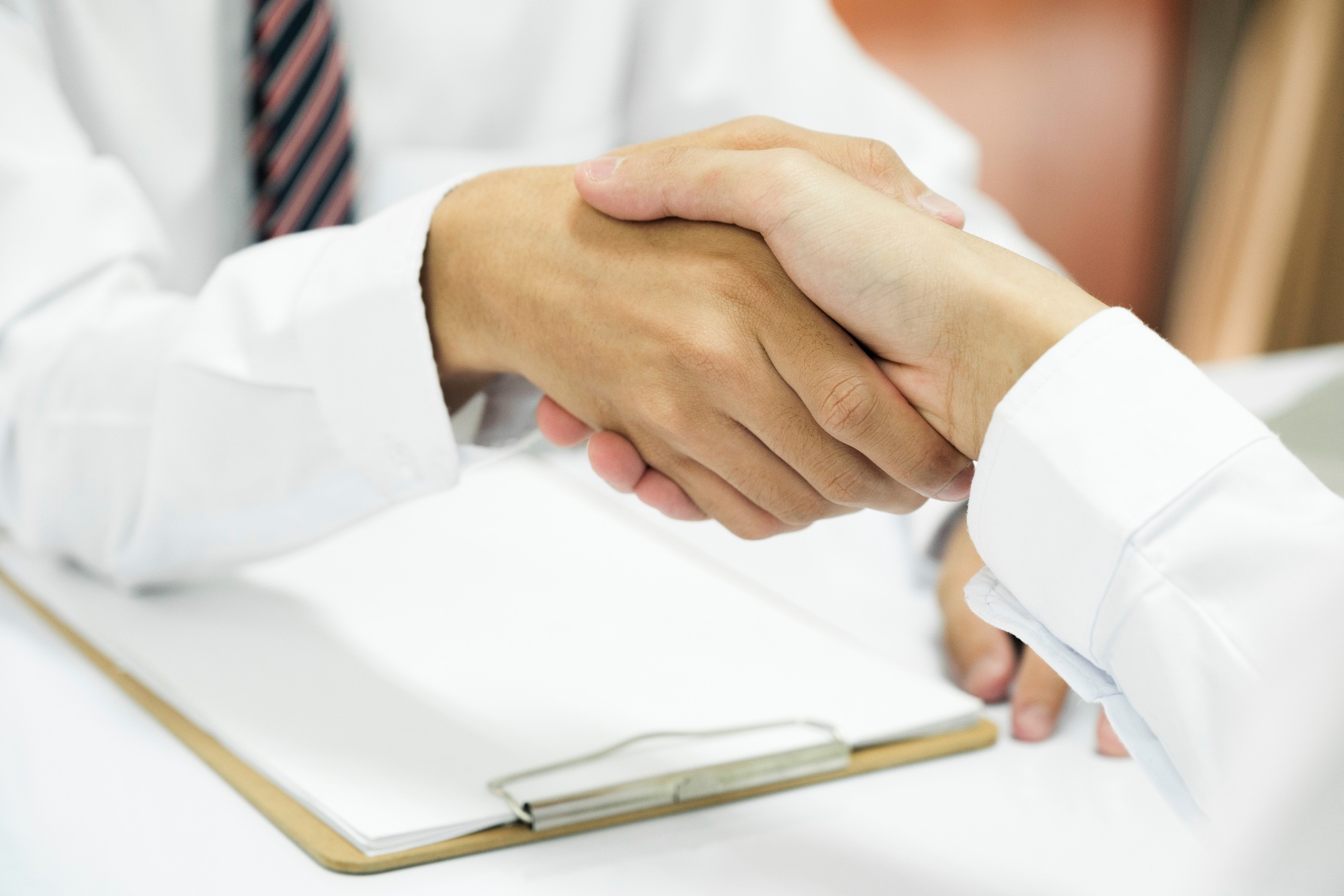 Judge and Businessman shaking hands after behind-the-scenes advice at attorney services concept cour