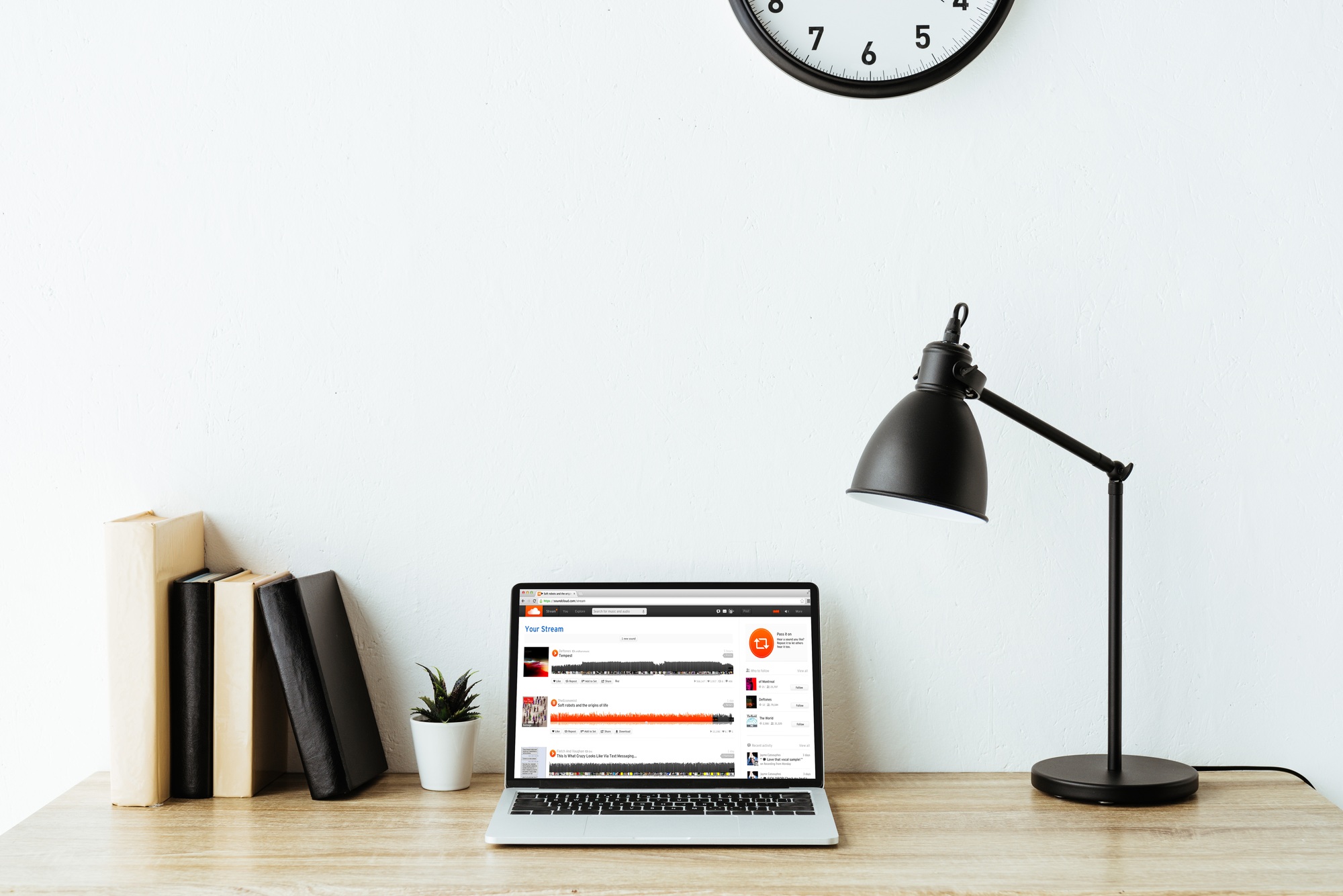laptop with soundcloud website on screen on work desk at office