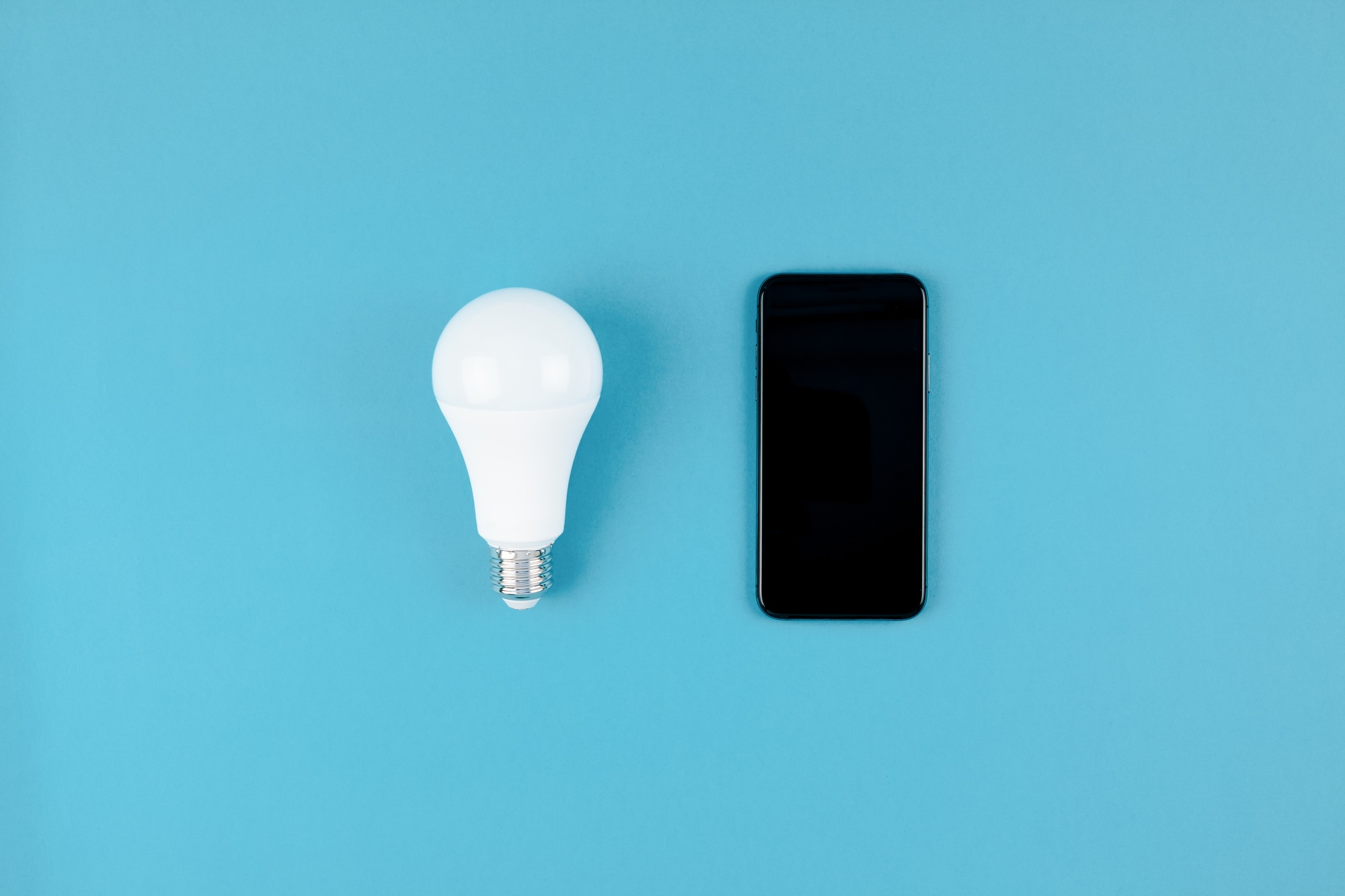 LED light bulbs and modern smartphone mockup