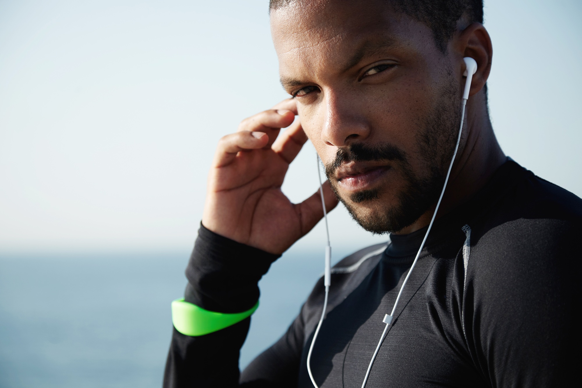Life goals and achievement concept. Portrait of confident self-determined African athlete wearing bl
