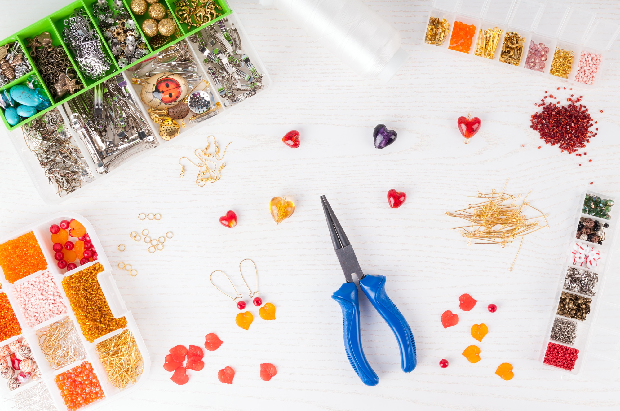 Making handmade jewelry. Boxes with beads, pliers, threads, equipment and accessories for handmade