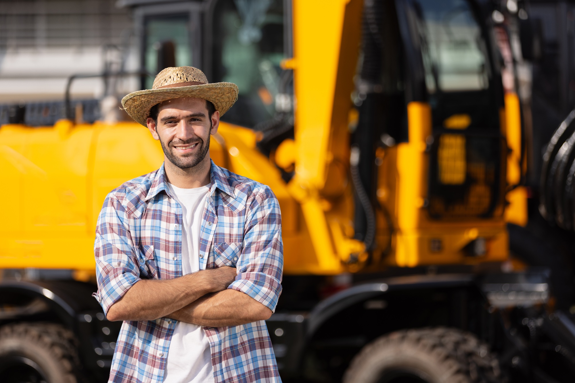 Male farmers visit a machinery expo to choose industrial waste separation machinery.