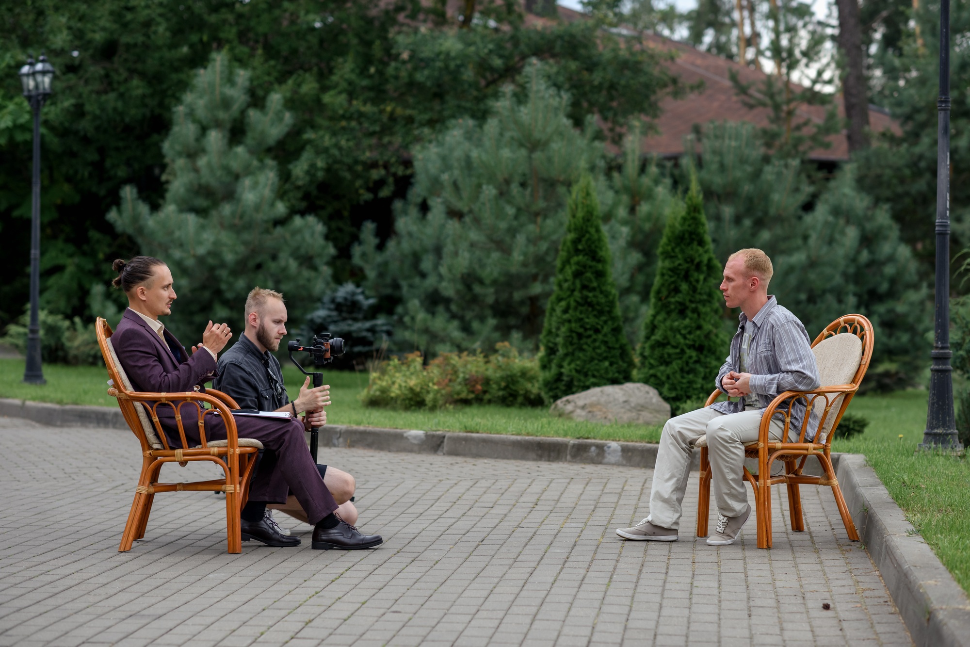male interviewer correspondent is interviewing and filming