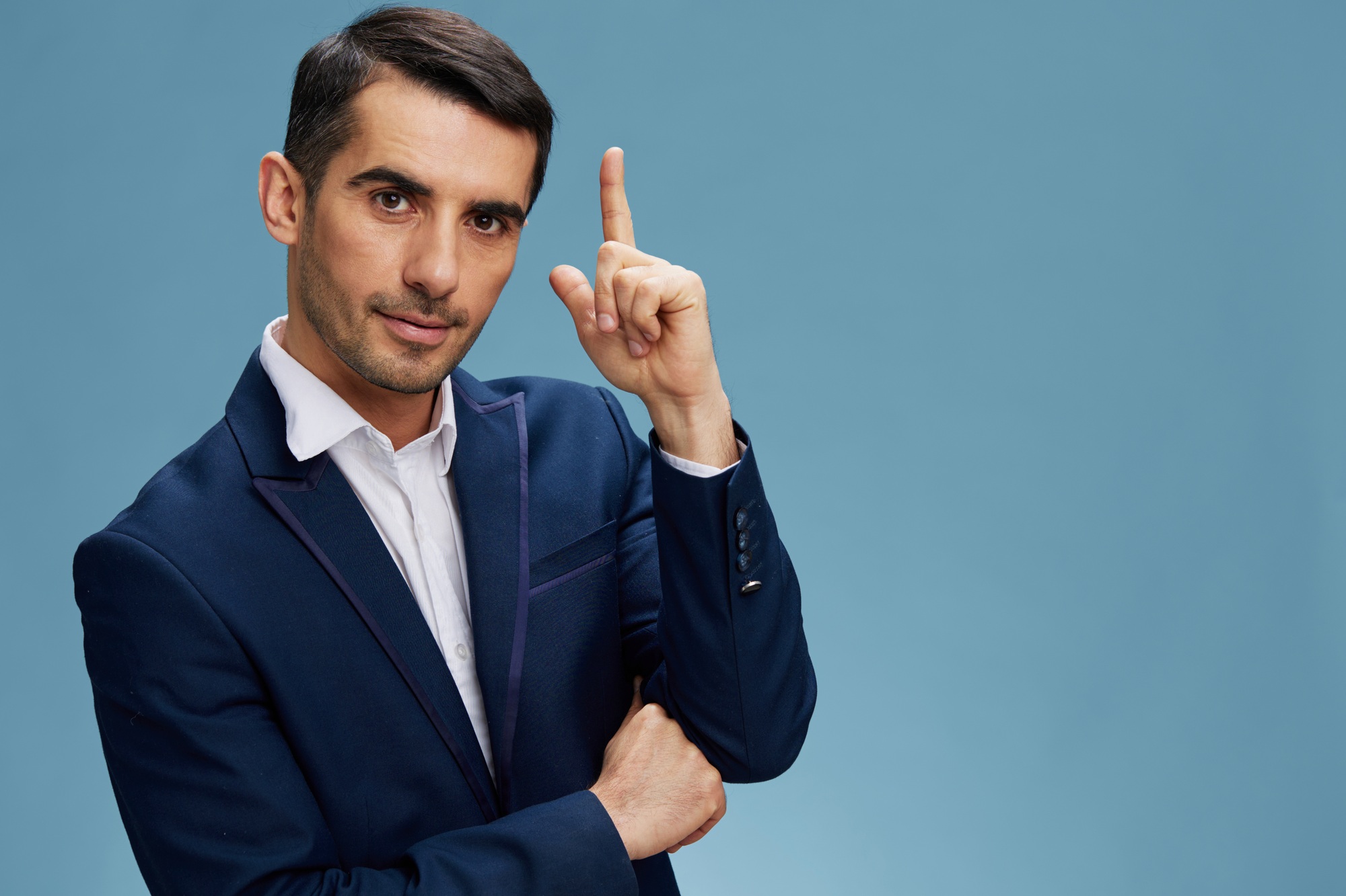 man in blue business suit holding thumbs up emerging idea work business plan professional blue
