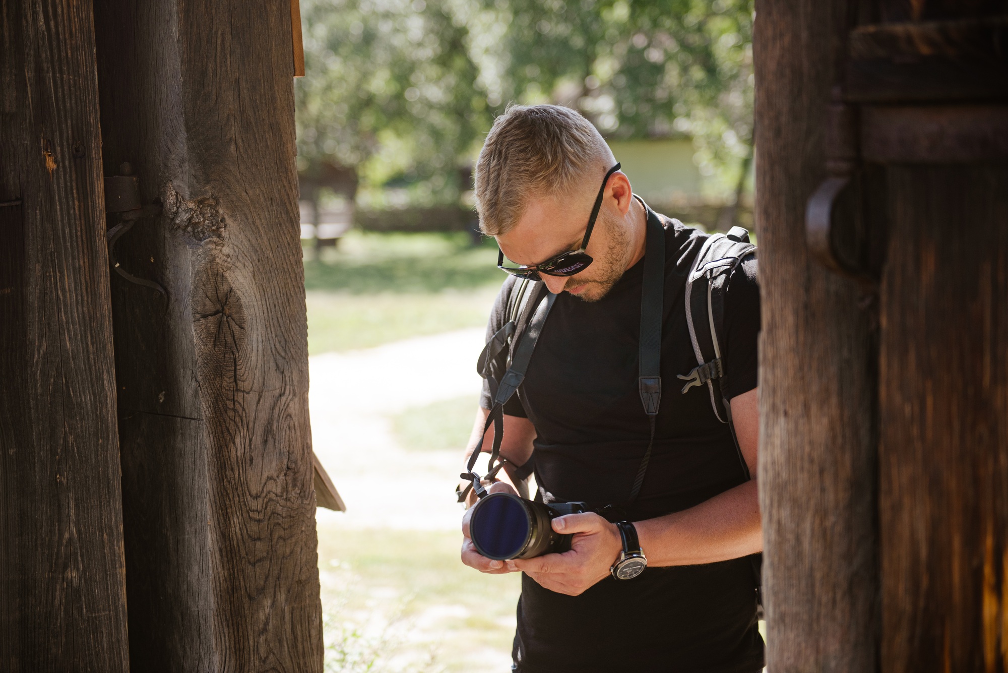 Man with camera creating video content.