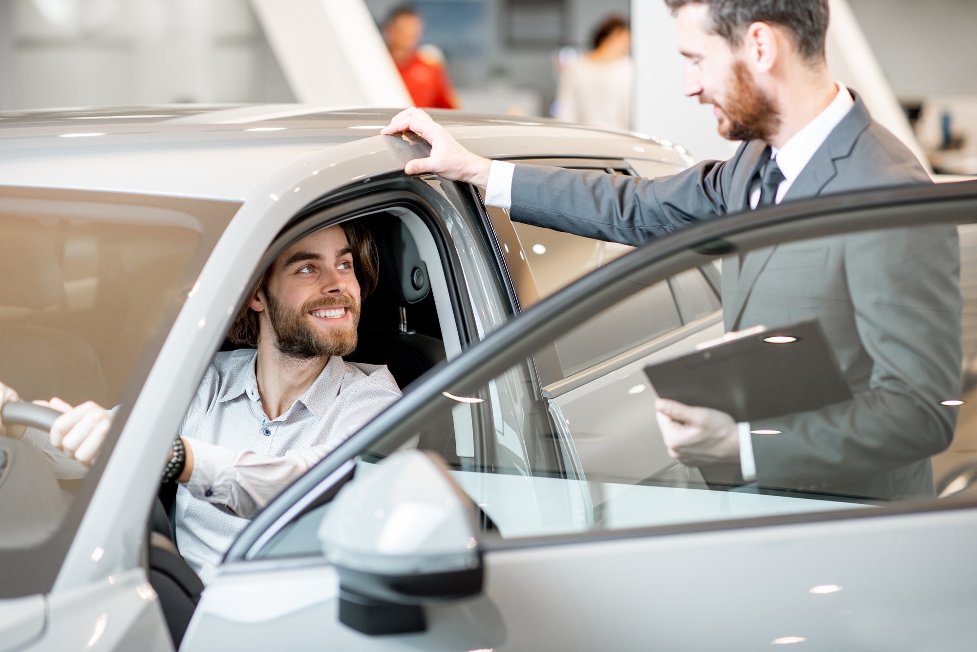Man with salesperson in the showroom