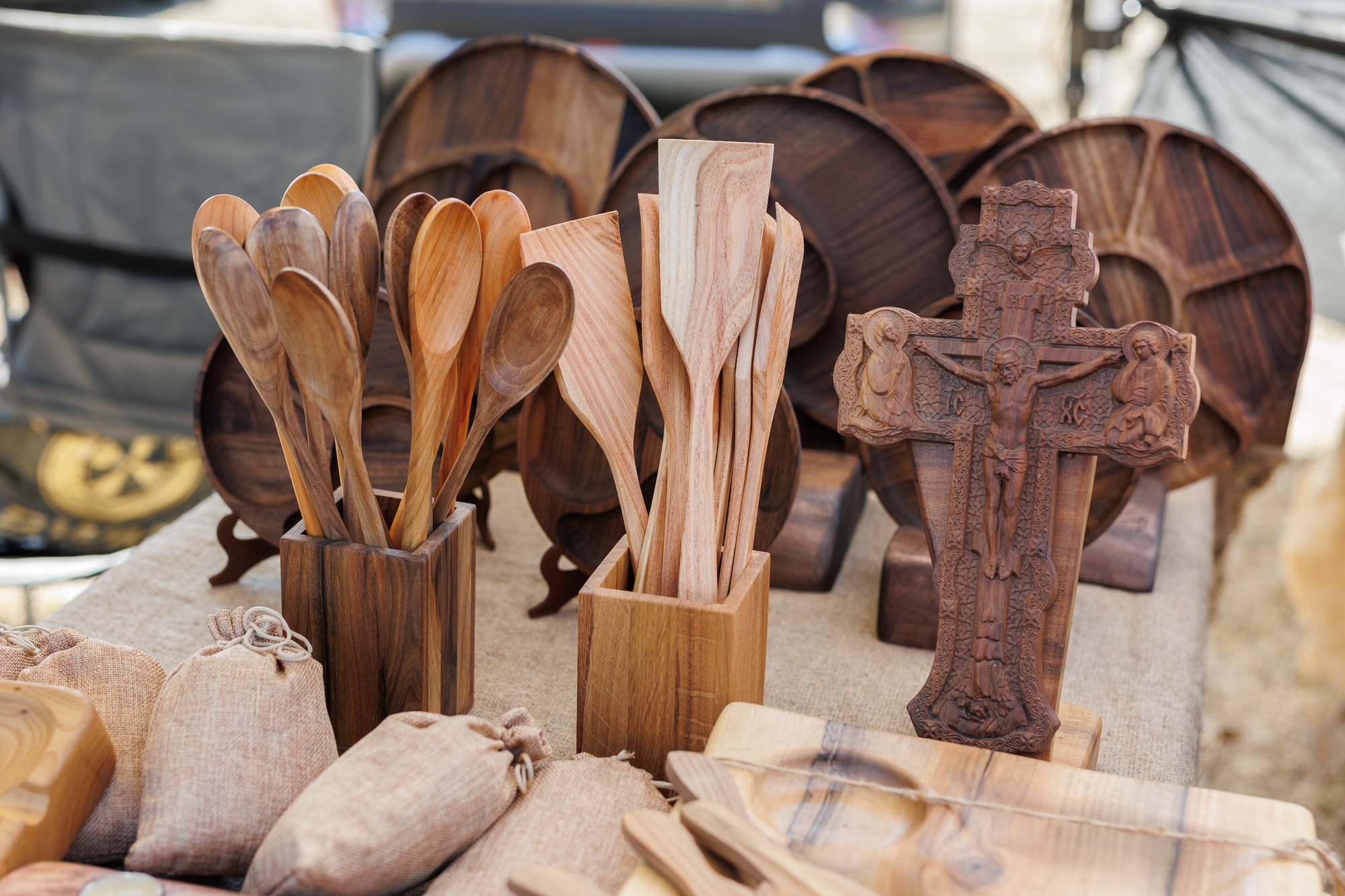 Market stall of handmade wooden utensils. craft market.