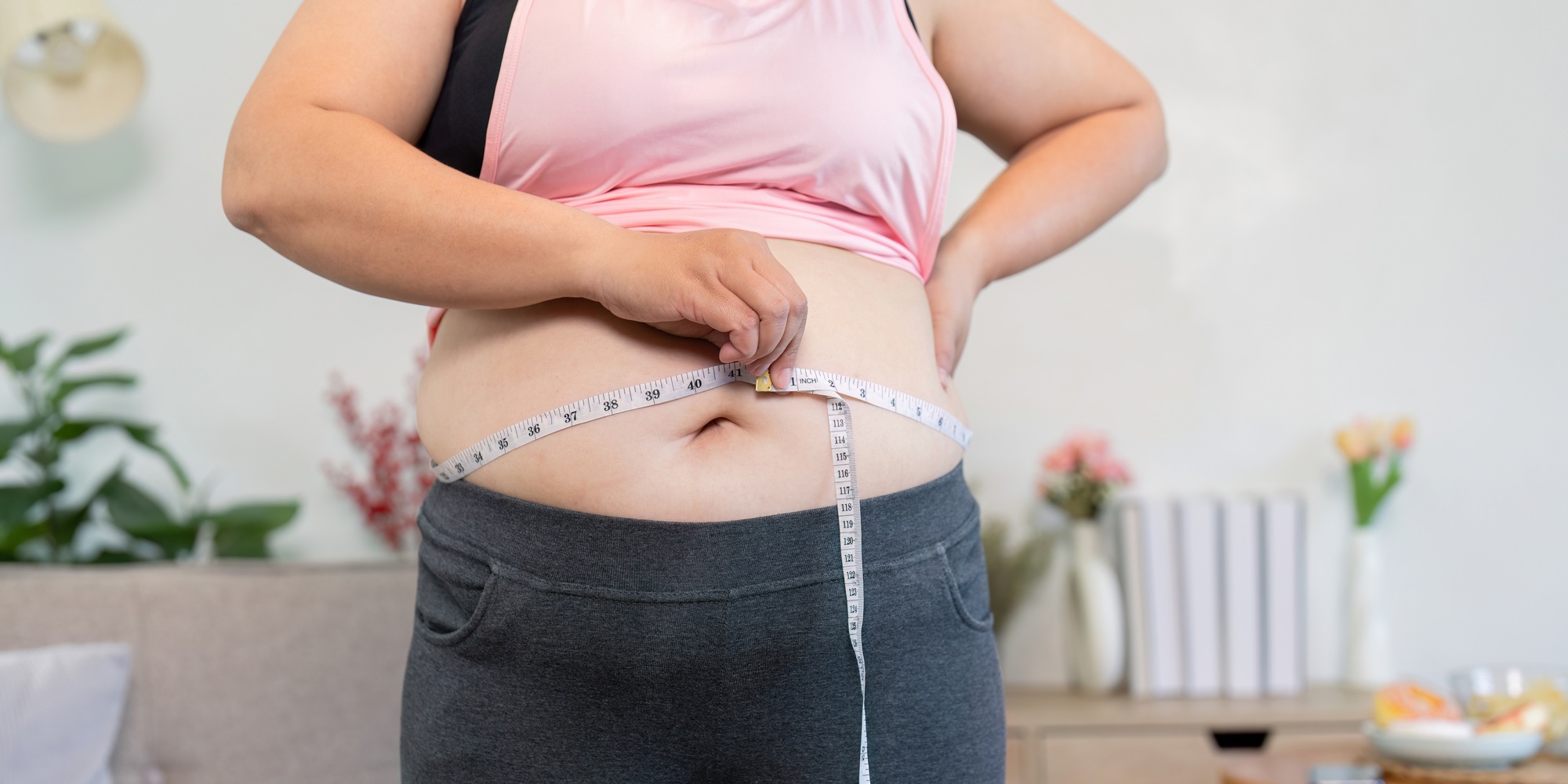 Measuring weight loss progress overweight individual home comfortable environment health concept