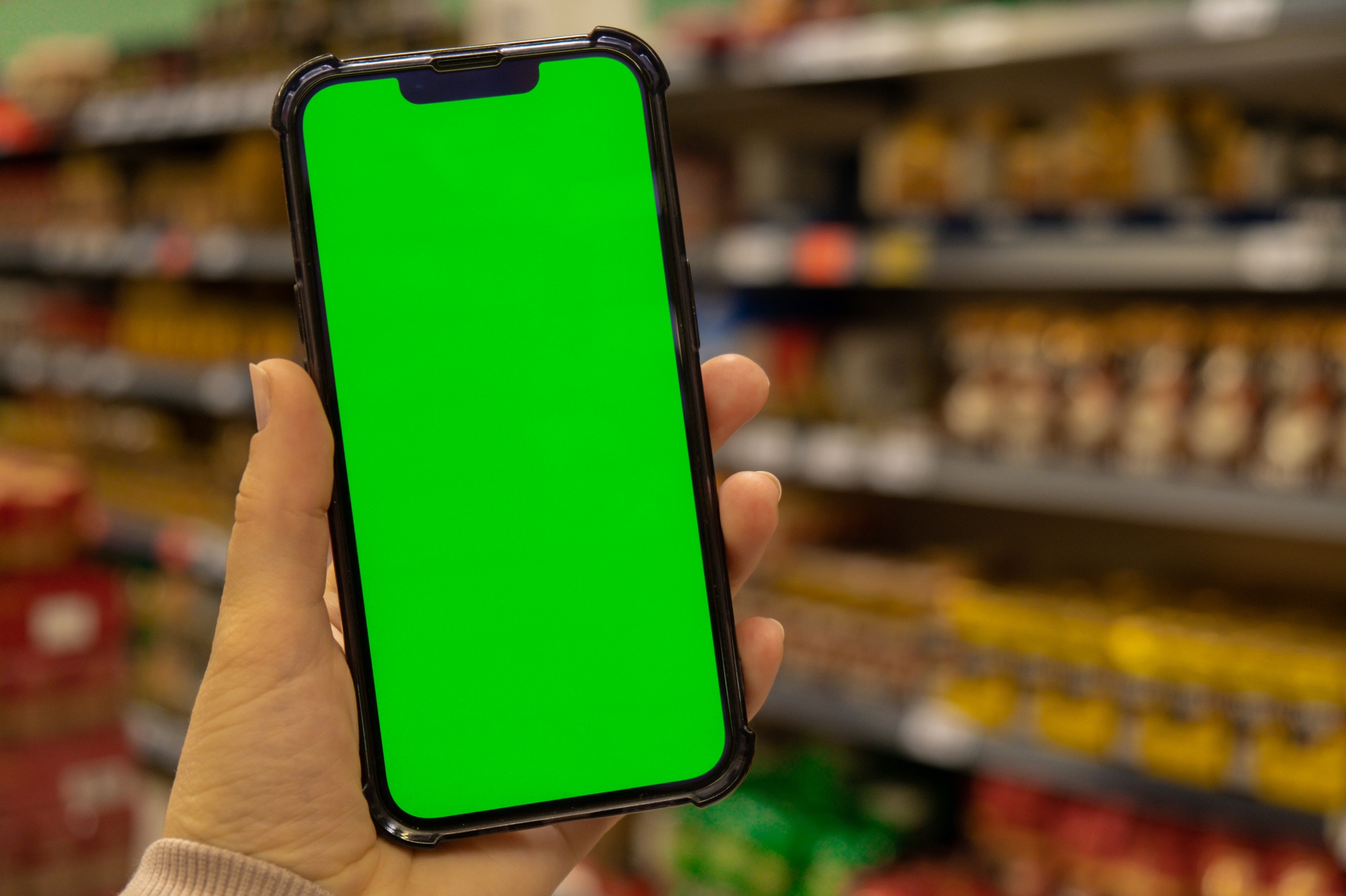 Mobile phone Chroma key for mobile app application. Close up of woman hand holds smart phone with