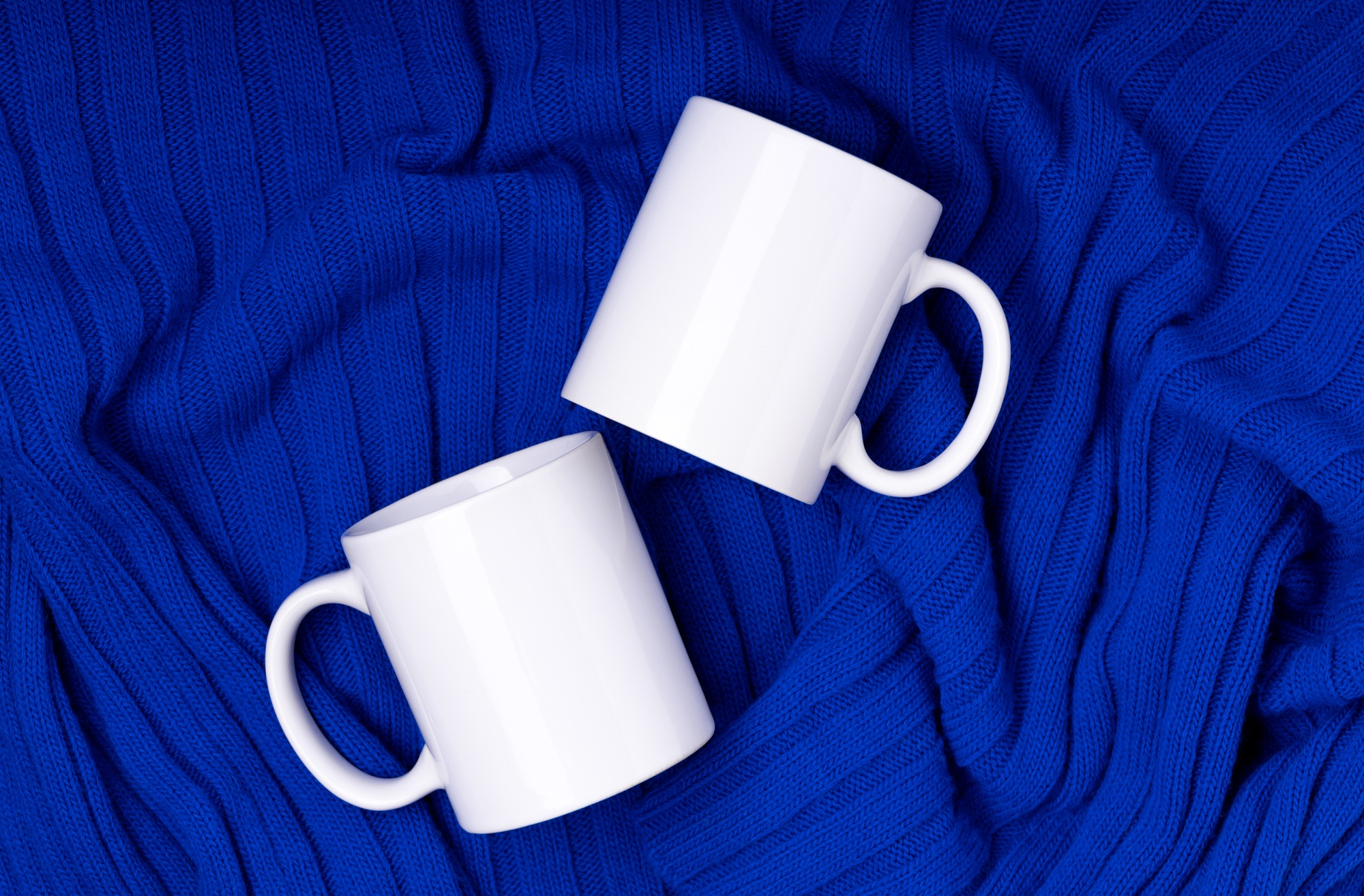 Mock up white empty mug, cup for your design and logo closeup. Template blank winter