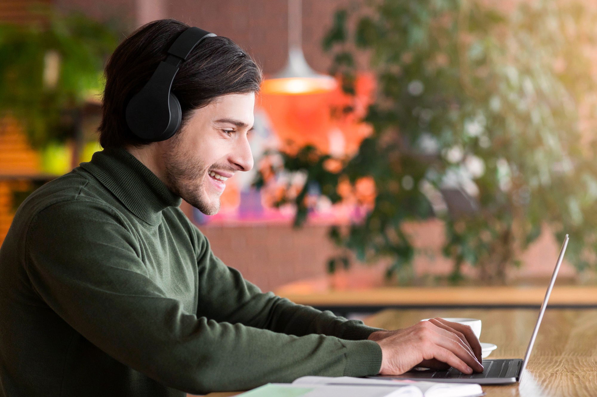 Modern businessman having skype conference on laptop