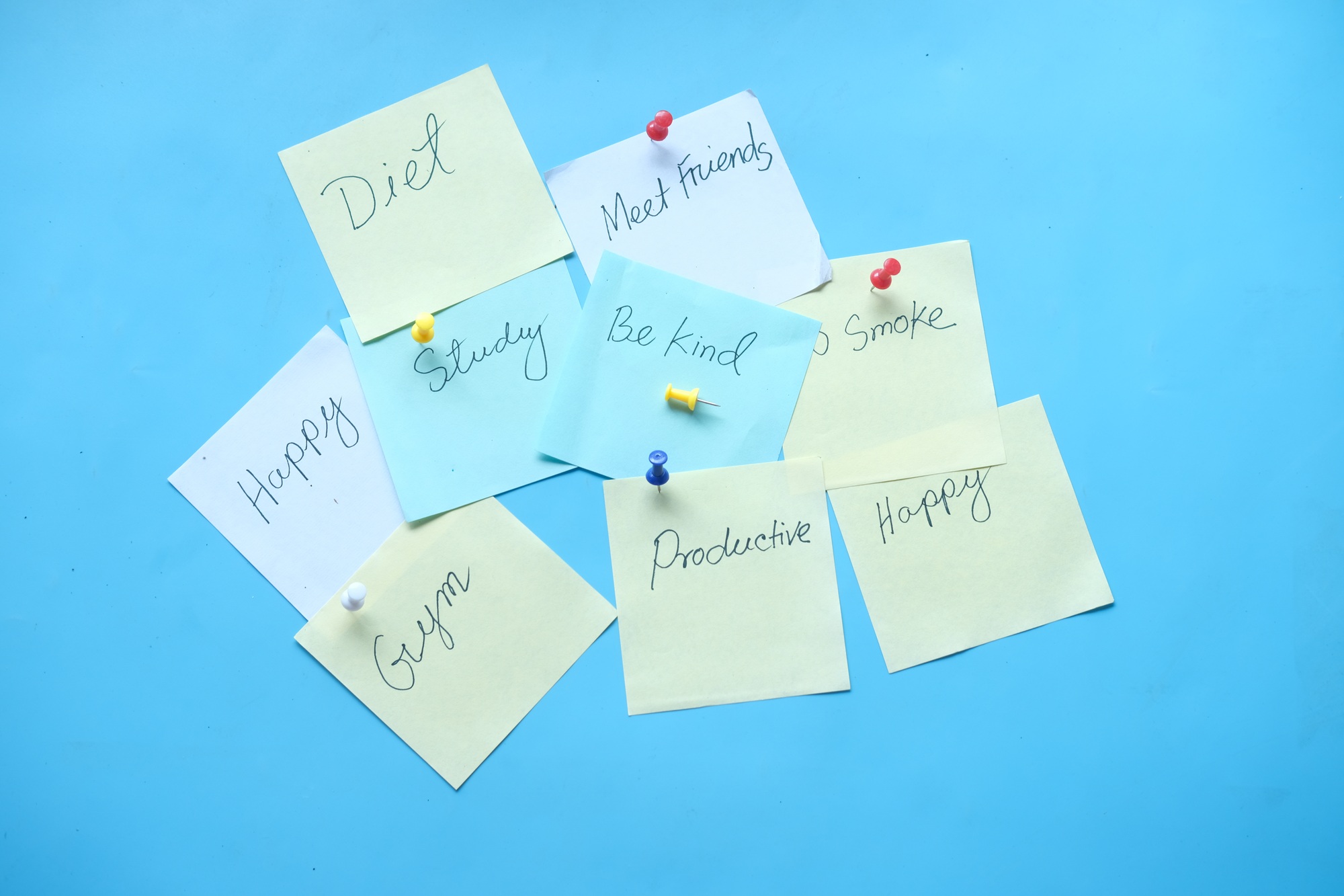 new year goals on a sticky note on table ,