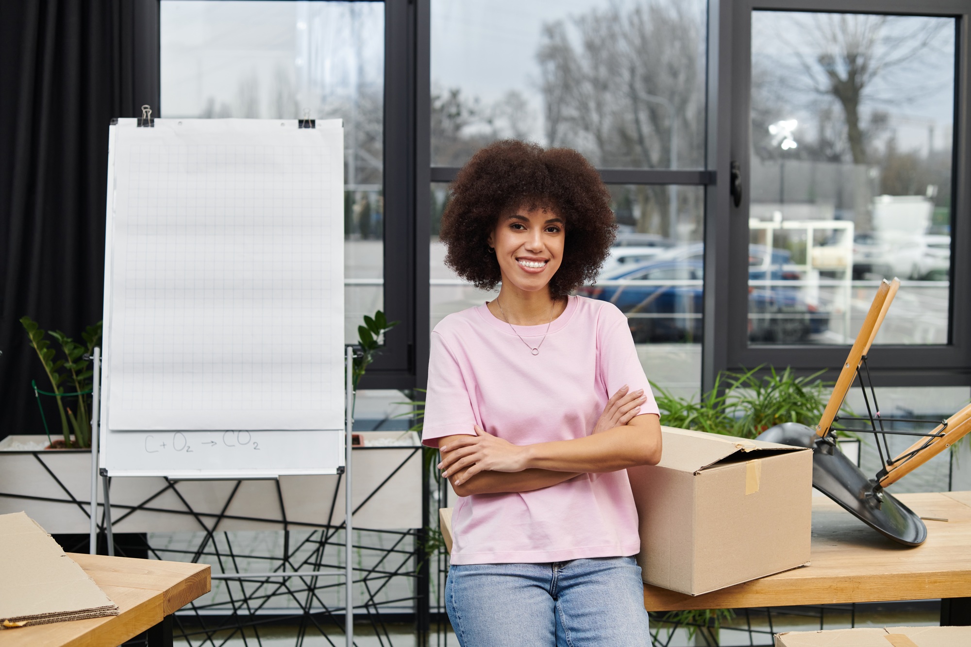 Packing and unpacking in a modern workspace with a confident individual ready for a new beginning